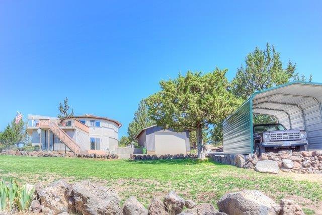 Are you looking for something special? With an amazing mountain & farmland view, surrounded by peace & quiet? And only minutes to the boat dock? This one owner, custom designed 2 level home features an open concept floor plan with views in every direction, a large deck for entertaining, updated kitchen, large master suite with sitting area and plenty of storage space. 24 x 32 RV/Shop/Garage with 12' overhead door and a separate covered parking pad. Weekends or weeks-on-end this home is sure to delight.