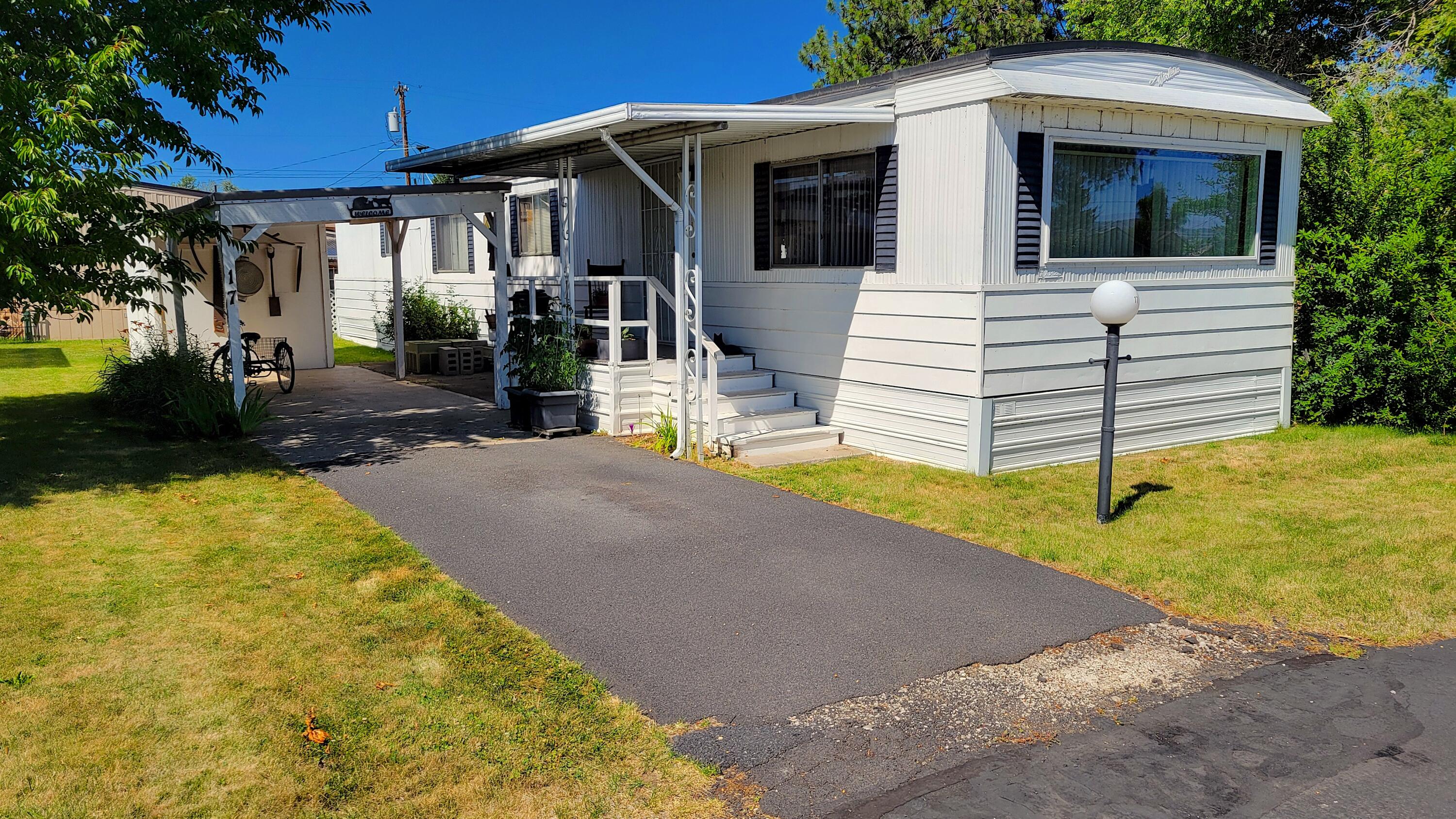 Spacious 2 bedroom 1 bathroom home in Terrace Mobile Plaza, an all age mobile home park! This home features 938 sqft of living space, has a carport to park under, and a storage area outside as well. The step up living room is good sized and overlooks the kitchen and dining area. Home has a newer roof, new roof on the carport, and a new water heater, all appliances included! Give us a call for a showing!