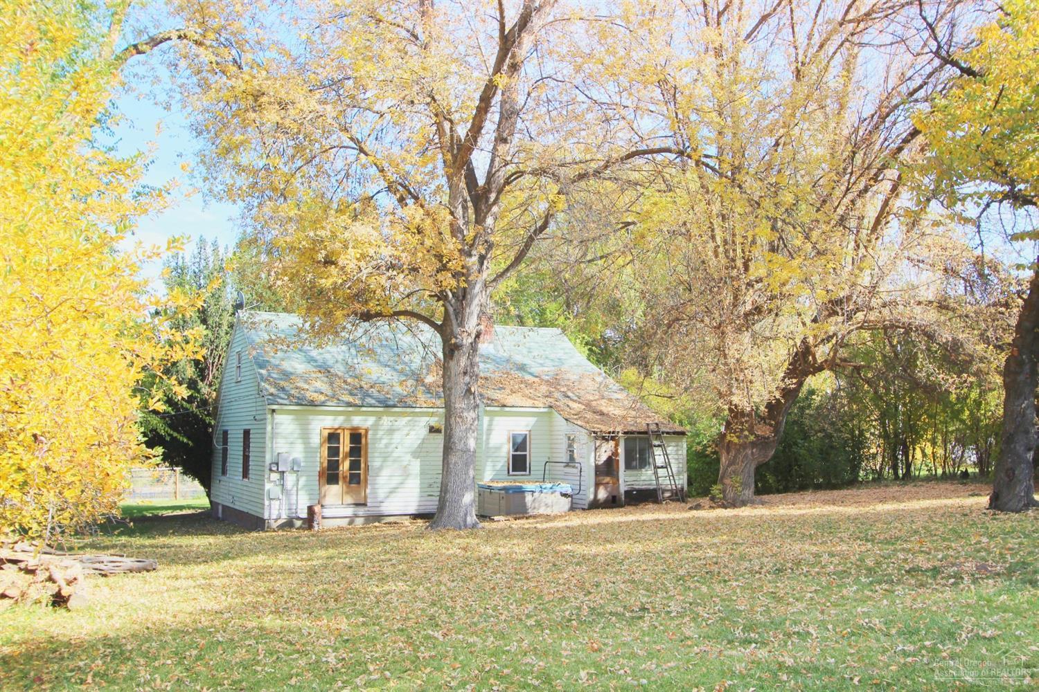 Offered at $99,999 cash only. Sweet bungalow in the quiet town of Dayville. Offering an oversized lot with plenty of space for animals. Hot tub is in good working condition, shop has plenty of space too. Come finish off the remodel and make it your own! Sand in place real wood floors, beautiful trim and a huge living room. Dayville is a great community with friendly neighbors, an old fashion mercantile, cafe with good food and more. Close to the fossil beds, outdoor recreation and within easy reach of John Day.