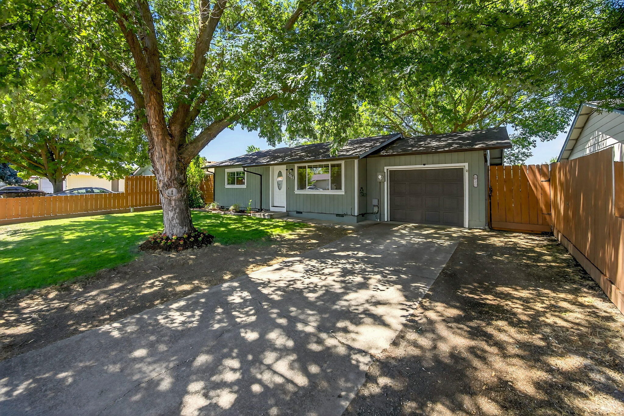 This charming home in a quiet Medford neighborhood is turn-key, move in ready! The home has been updated in recent years with a newer roof and gutters with leaf guards, a new sewer line, vinyl windows, water heater, interior paint, granite counters in the kitchen, fixtures and an updated bathroom. Outside you'll enjoy a large deck for relaxing or entertaining, a spacious fenced yard for the kids or pets to run and mature shade trees for those hot summer days. It has all been well maintained and cared for providing the perfect opportunity to move right in and enjoy. In addition, a one year home warranty is included in the sale. A wonderful home, great location and priced to sell, don't wait to tour this one in person!