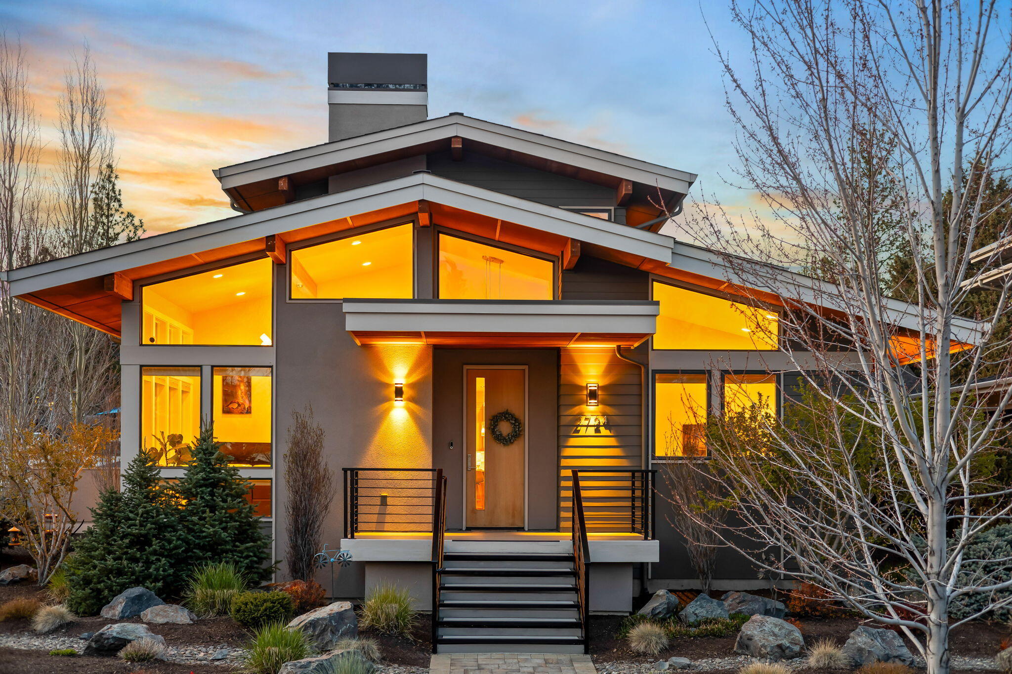 Nestled on a corner lot in desirable Northwest Crossing near Discovery Park, this beautiful contemporary home showcases a seamless blend of style and efficiency with soaring vaulted ceilings + abundance of windows filling the space with natural light. Oak hardwood floors flow thru living and dining areas into the kitchen, highlighting the triple-sided fireplace. Kitchen boasts quartz counters, ample storage and a sleek island. Perfect for entertaining which can expand outdoors to the large side deck and yard. 
Main-level primary suite features a lovely bath with heated floors, dual counters and a spacious closet. Upstairs are 2 bedrooms, a full bath and  generous bonus room wired for sound, has a fireplace plus a private deck. 
Enjoy the beautiful, professionally landscaped yard and oversized garage with custom storage. Central vac, dual-zone HVAC, attic storage and recent exterior paint complete the package.