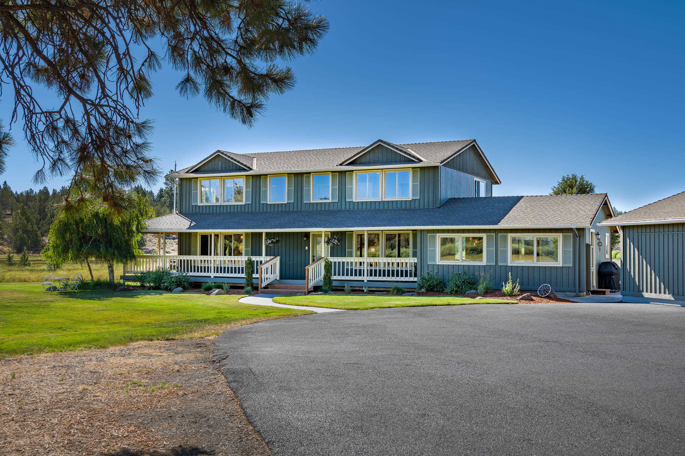 Discover your dream home with stunning views of Broken Top and Mt. Jefferson. This tranquil and well cared for home is conveniently located only one mile from Sisters and all that Central Oregon offers. Home is adjacent to a meadow which allows for all types of wildlife that makes this home feel like an oasis. Views of the mountains and meadow are ample from all parts of home and deck. Home has been updated over the past four years, including a completely modernized kitchen with granite counters and alder cabinets. Master bed on the main level. Home has 4 beds, 3.5 baths and separate apt has 1 bed and 1 bath. Additional separate studio w/529 feet not included in sq ft plus a double door hangar of 3492 ft which allows for incredible options for working from home and/or storage of planes, recreational vehicles and more. Property is adjacent to taxiway for easy access to runway. Enjoy the peacefulness of this exquisite property offering both privacy and convenience in a park like setting.