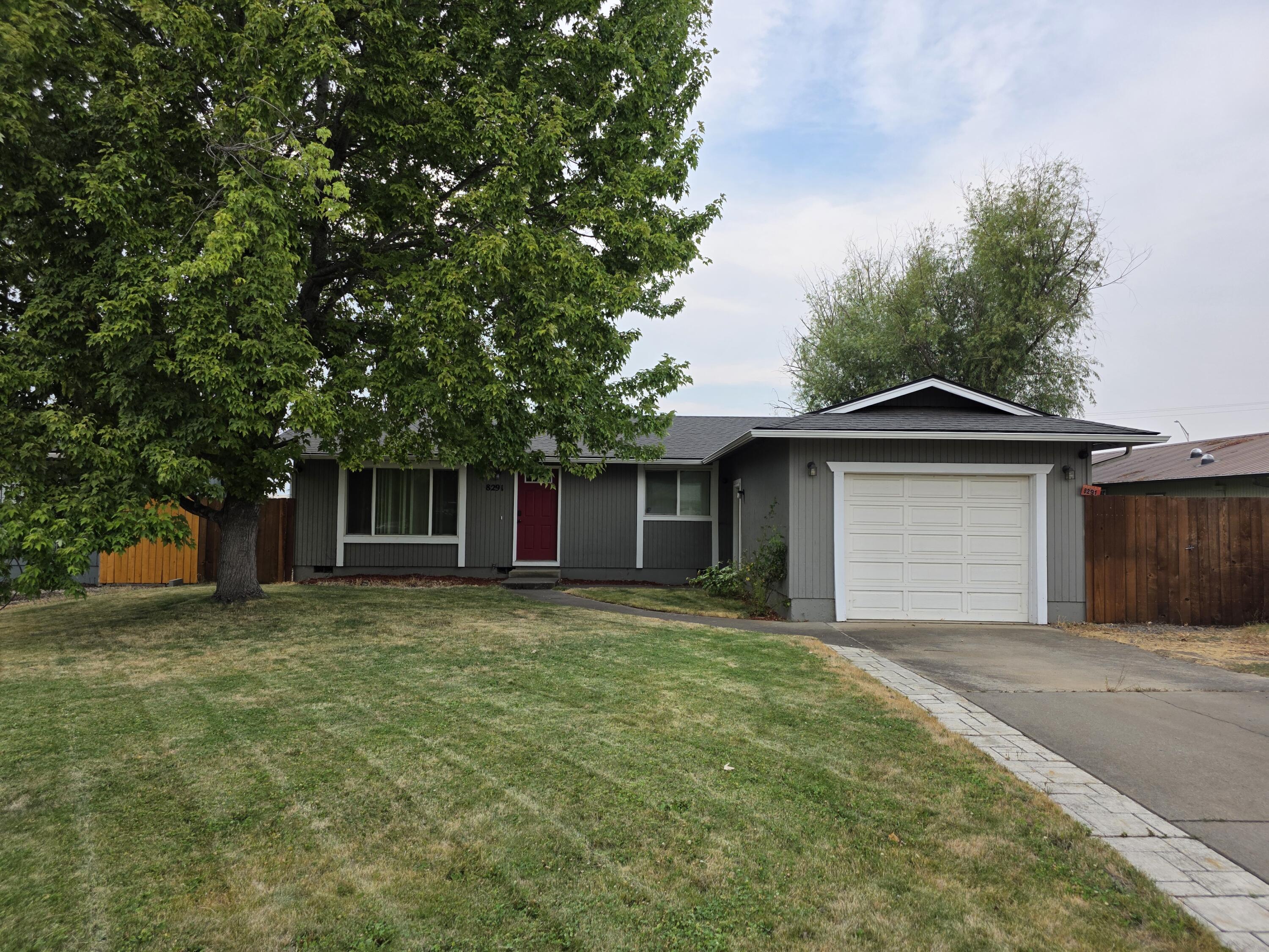 Charming and beautifully updated 3-bedroom, 1-bath home in White City! Laminate flooring runs throughout the main living areas, with brand-new vinyl in the kitchen and bathroom. The kitchen offers generous counter space, a range/oven, microwave, dishwasher, and overlooks the spacious backyard. Adjacent dining area opens to a large deck with pergola, leading to a paver patio and fully fenced backyard—ideal for entertaining, BBQs, or relaxing evenings. The roomy primary bedroom has direct access to the updated bathroom featuring a gorgeous tile shower with two built-in shelves. Convenient laundry area includes upper cabinets for storage. Additional features include a linen closet, coat rack with entry bench, single-car garage, and a large front yard with mature shade tree. This home is move-in ready and full of charm—don't miss your chance to make it yours!
