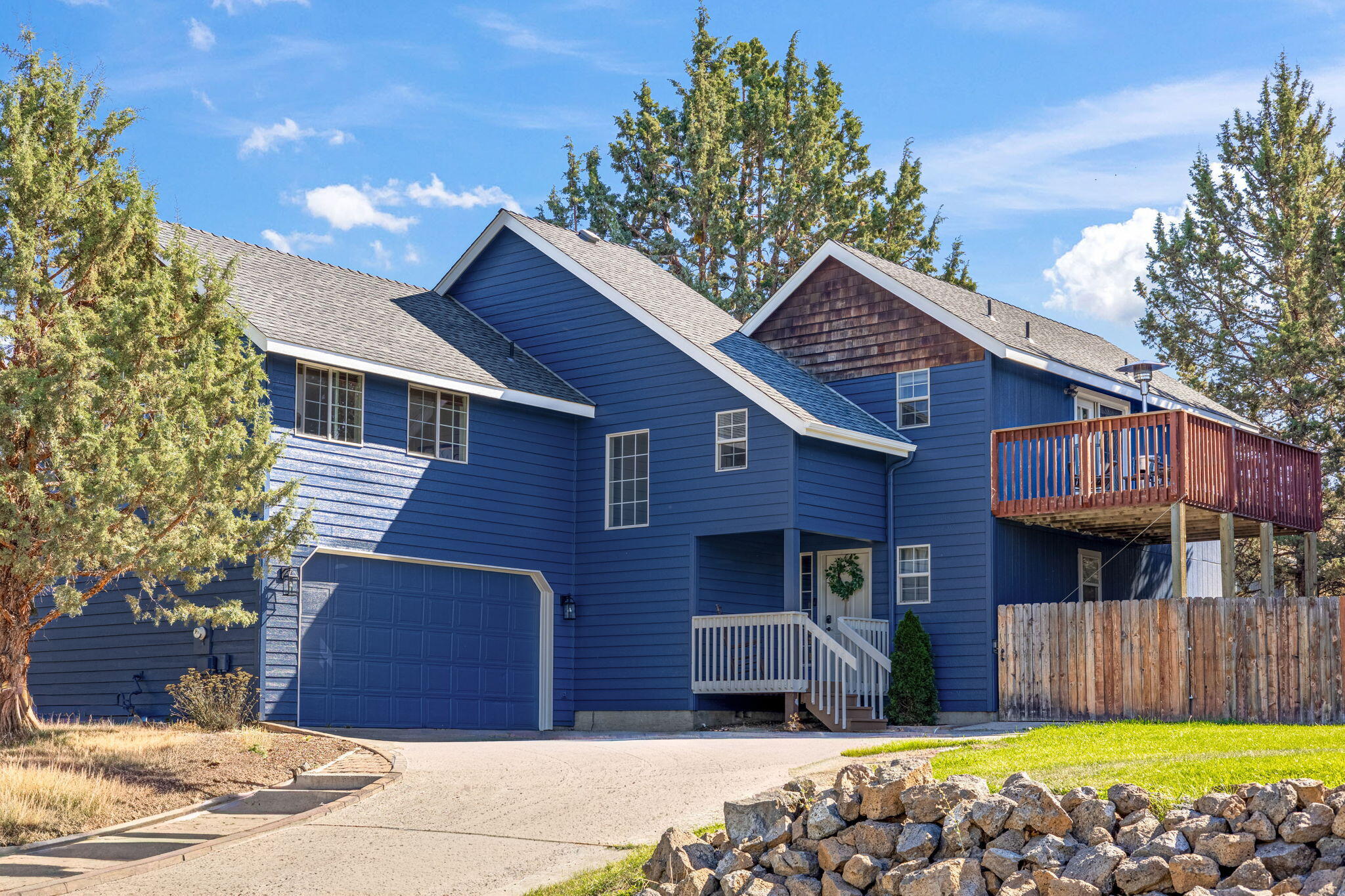 Take advantage of a 5.125% FHA assumable loan and move right into this beautiful 4-bedroom home located in a quiet neighborhood close to schools, parks, and the hospital. Inside, you'll find new luxury vinyl plank flooring on the main level, fresh kitchen countertops & backsplash, and a bright, open-concept design that seamlessly connects the kitchen, dining, and vaulted living room. Natural light fills the space, creating a warm & inviting atmosphere. The main floor primary suite provides the convenience of single-level living, while upstairs, you'll discover a large bonus room that can be used as a family room, play area, or bedroom. A dedicated home office is perfect for remote work or study. Additional highlights include: brand new exterior paint, new oven, EV charging station in the garage, new roof in 2020, and a spacious backyard. Enjoy sunset views from the upstairs deck. Don't miss your chance to enjoy modern updates, generous space, and an attractive financing opportunity.