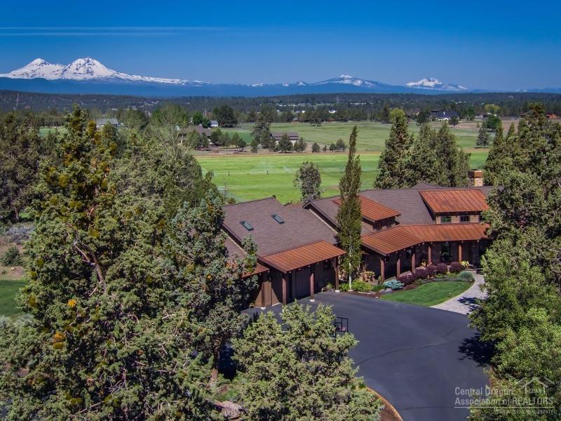 Tumalo NW Style Home on 20 acres with beautiful Cascade Mountain Views. Custom home is 4000 sf, 3 bedroom, 3.5 bathroom, living room with stone fireplace, gourmet kitchen, pantry, family room, office, master suite with a tub, gym/office, 3 car garage and landscaped with pond. The property includes: 16.49 acres of Swalley irrigation water rights with underground sprinkler system, planted in grass pasture, shop with concrete floors, fenced, paved driveway. The setting is private and close to Bend.