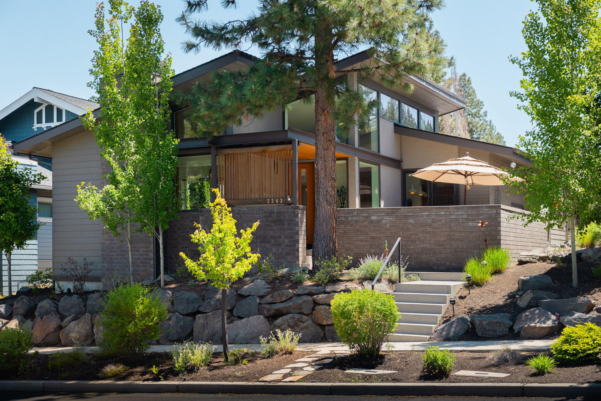 This stunning Northwest Crossing contemporary style single level home on a quiet tree lined street features two bedrooms with office/potential third bedroom, two bathrooms and premium finishes throughout. Designed by Neal Huston & Associates and built by Greg Welch Construction, the attention to detail and modern flair are truly a dream come true. Entertain in front of the fire in the Great Room or outside on the private patio or private courtyard/deck. Earth Advantage Certified, this home boasts dual zone high efficiency heating/cooling, Quartz countertops, stainless steel GE Café appliances, Grohe & Kohler fixtures, hardwood flooring, horizontal grain walnut cabinets, tile shower and bathtub...just to name a few designer features. Close to Compass Park, Sunrise Park, NWX Farmers Market, shops, restaurants, trails. Truly a gem in the heart of Bend.