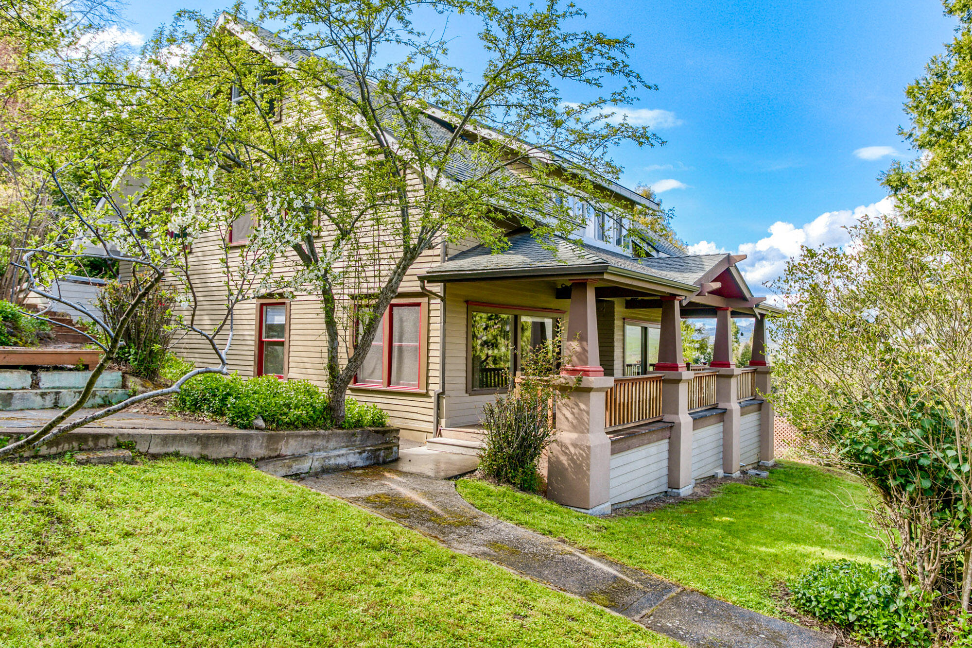 This rejuvenated vintage Craftsman home offers incredible views of the valley and still just a short distance to Ashland's downtown plaza. Built in 1910 with extensive renovations, this home maintains period charm while offering modern comforts and style. A deep porch spans the entire front of the home, providing the perfect place to take in the view or relax with a morning cup of coffee. Moving inside, built-in cabinets and wood floors provide warmth and character. With over 2800 sf of living space, rooms are spacious and provide a sense of space, unique to this era of home. Windows abound allowing for plenty of natural light and the opportunity to enjoy the view
from multiple angles. The updated kitchen with cherry cabinetry, granite counters and gas range are the perfect backdrop for entertaining. With a generous .3 acre lot, there is plenty of room for outdoor living and the separate artist studio rounds out this unique property.