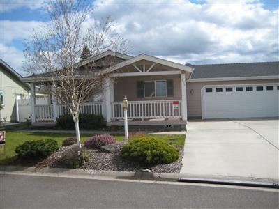 Home Sweet Home! Nicest over 55 MH Park in the area. Lovely neighborhood of very well cared for homes and landscaping. This 2/2 plus den MH is move in ready! Shows like new. Ex. large rooms and backyard. Insulated garage with shelving and sink. Small park with great neighbors.
