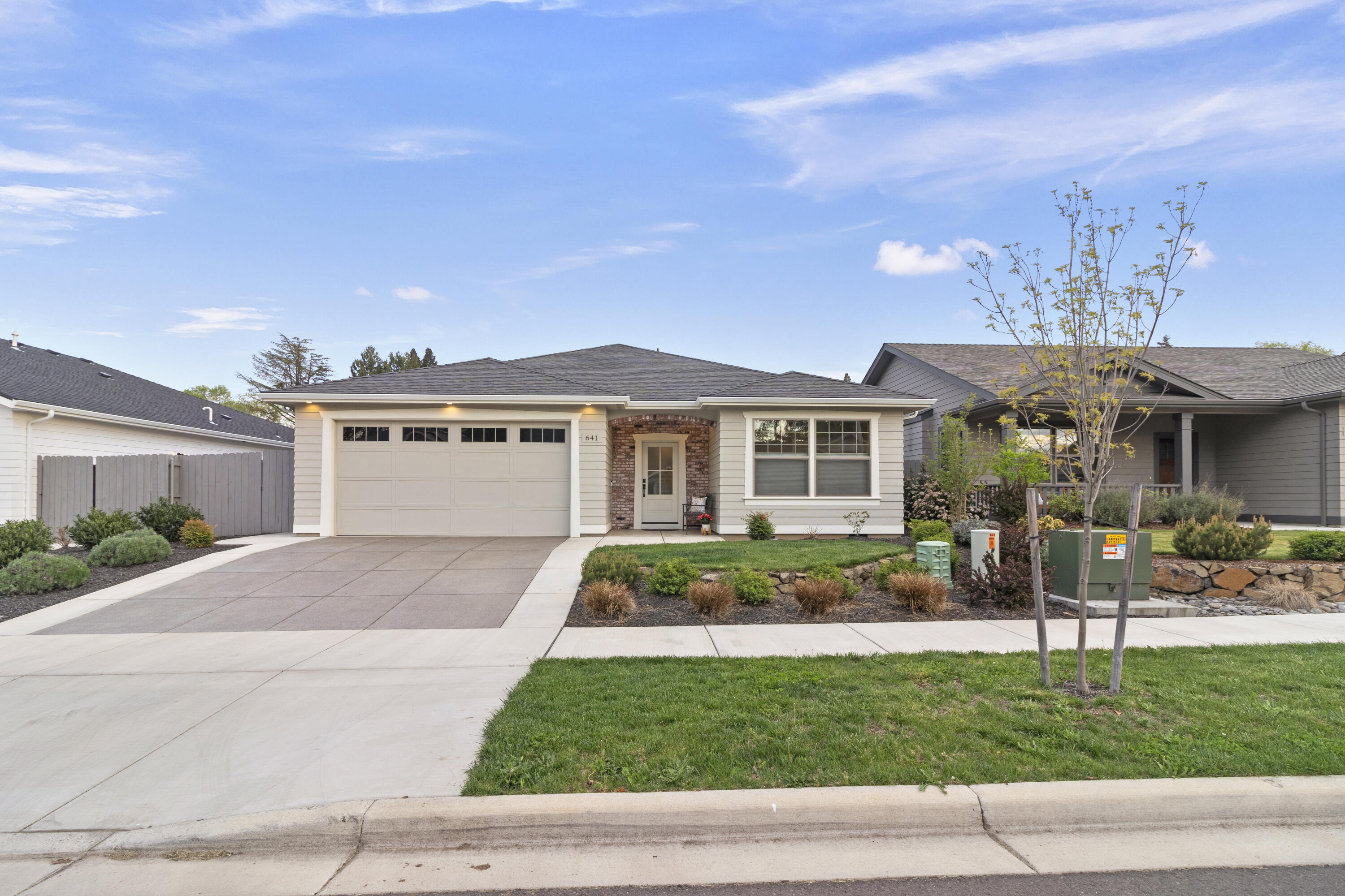 Gorgeous one level contemporary, craftsman style home in South Medford with attention to detail & designer features. Open floor plan with engineered hardwoods, box beam ceiling, gas fireplace & A/C! You'll love the kitchen with quartz counters, wall of cabinets & SS appliances, including a gas range. Coveted large pantry with barn door and the essential island complete with bar seating. Retreat to the spacious main bedroom boasting vaulted ceiling & en suite bathroom offering double sinks, large walk-in tiled shower & walk-in closet. Plenty of space including two additional bedrooms & full bath. Even the laundry room is lovely with designer tile & built-in cabinets. Double car garage with extra attic storage. Fully fenced landscaped yard adds privacy along with a covered patio, space for fire pit, grill, smoker, pizza oven. Detached workshop/shed offers even more storage or craft space. Little or no electric bill with owned SOLAR panels. Quick trip to Cartwright's, Golf Course & I-5.