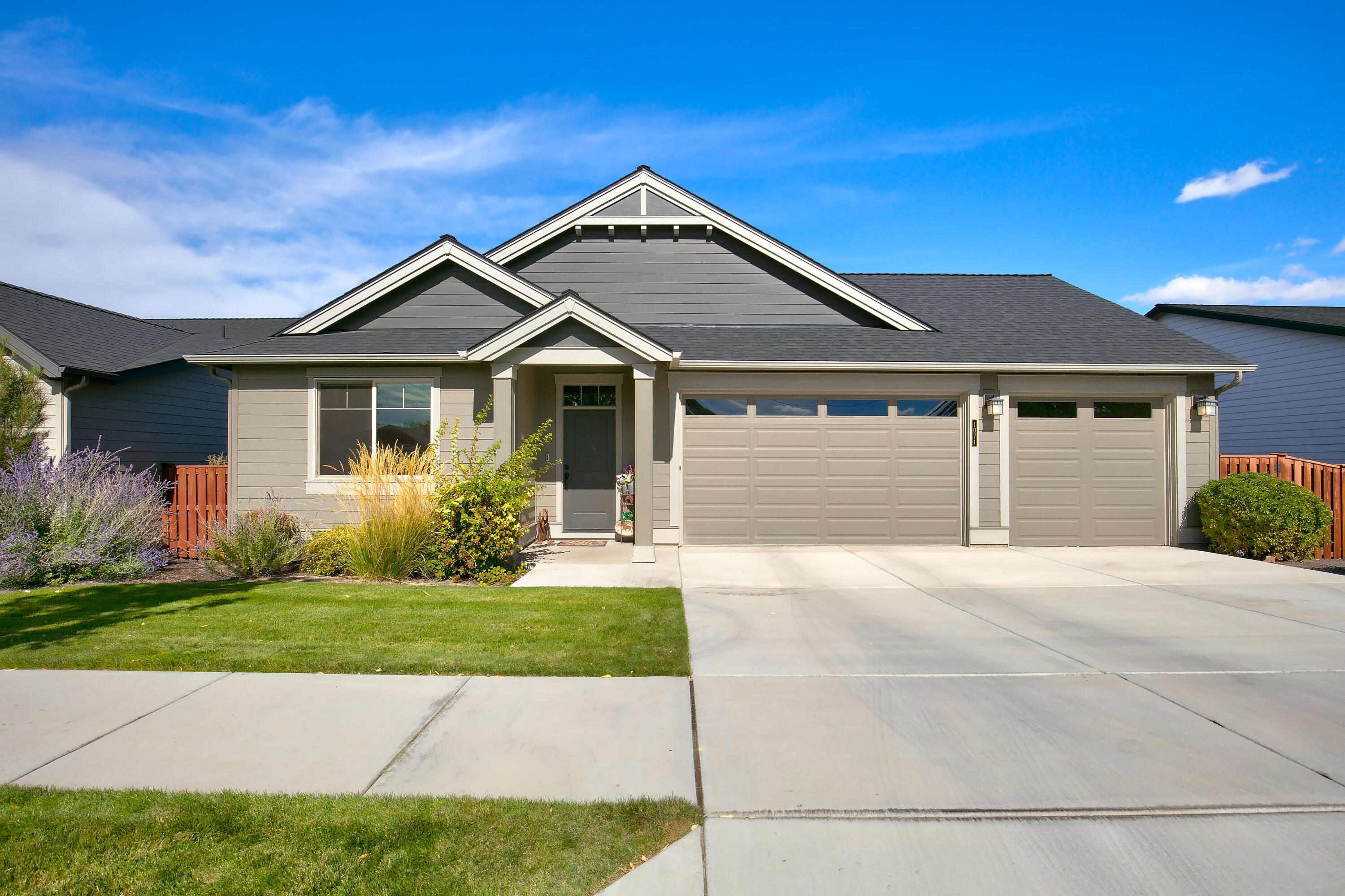 Discover this beautiful single-level home, crafted by Pahlisch Homes, featuring a thoughtful open floor plan with quality finishes throughout like quartz countertops, luxury vinyl plank flooring, undermount sinks, and a masonry faced gas fireplace. Single level home is 1856 sq ft, 3 bedrooms, 2 bathrooms, office, secluded primary suite with a walk-in tub and tiled shower. The 3-car garage offers ample space for a workshop, while the back deck overlooks mature trees and low-maintenance landscaping. Conveniently located near a paved walking path that connects to over 620 acres of public and BLM trails, leading to the protected wetland reserve, Barnes Reservoir, and Barnes Butte trails.