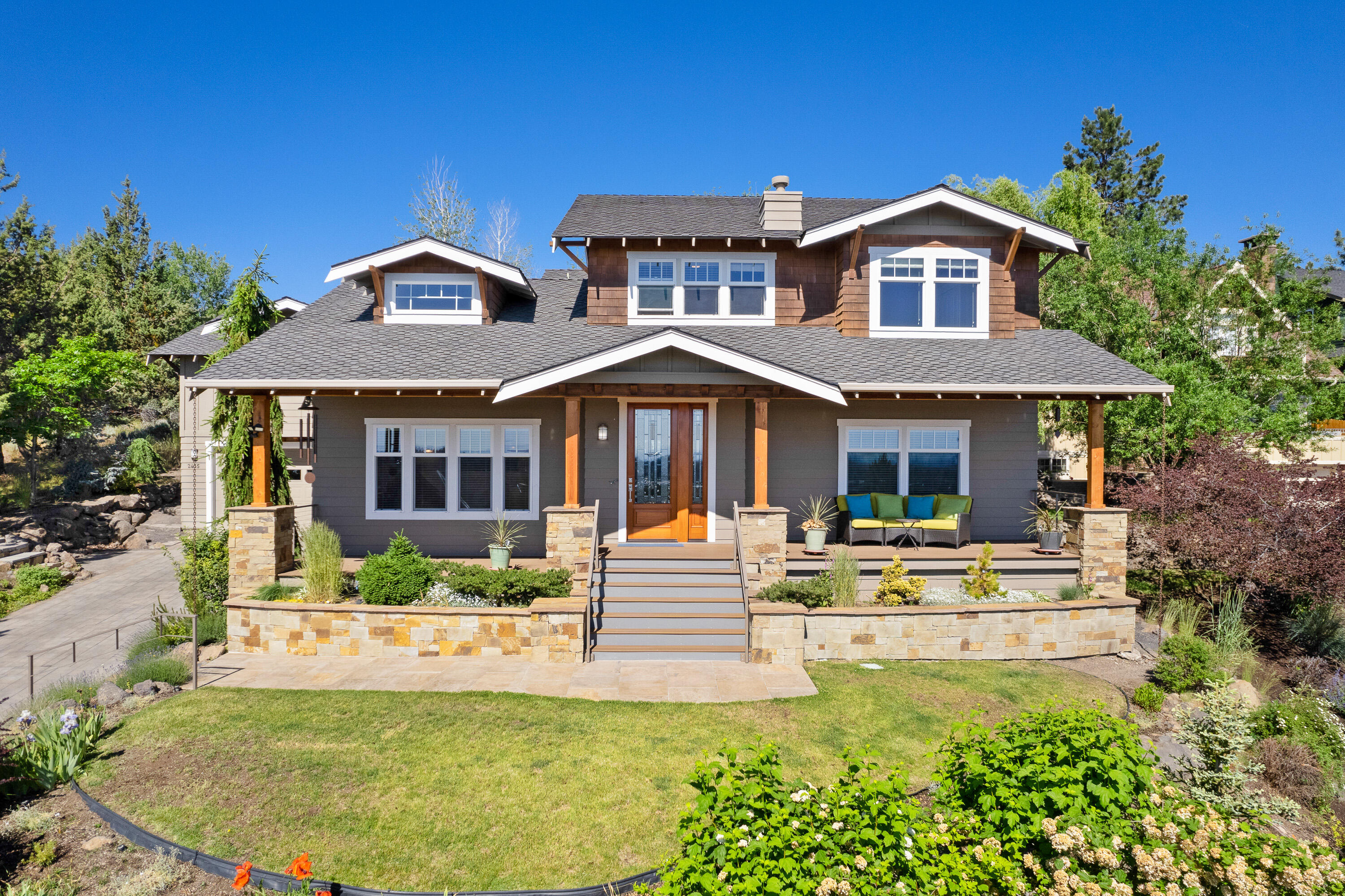 Enjoy watching the peaceful morning sunrises over Easterly Pilot Butte with outstanding Deschutes river views from the front porch of this extraordinary Westside home.  The main level boasts a welcoming great room, built-ins, skylight and new fireplace creating an atmosphere of entertainment and relaxation.  Enjoy a spacious chef's kitchen with an adjacent dining area, private primary suite with a cozy fireplace, luxurious bathroom with soaking tub and tiled shower,  brand new wool carpeting and a giant walk-in closet featuring custom California Closet build-out. Upstairs you will find three additional bedrooms, a spacious family room with unbelievable river, easterly and city views.  Head up to a private staircase that leads to a large, two room bonus area.  Ideal for separate home offices and/or work out room, sewing/quilting room, fly tying /media room or add a bath and create an ADU....