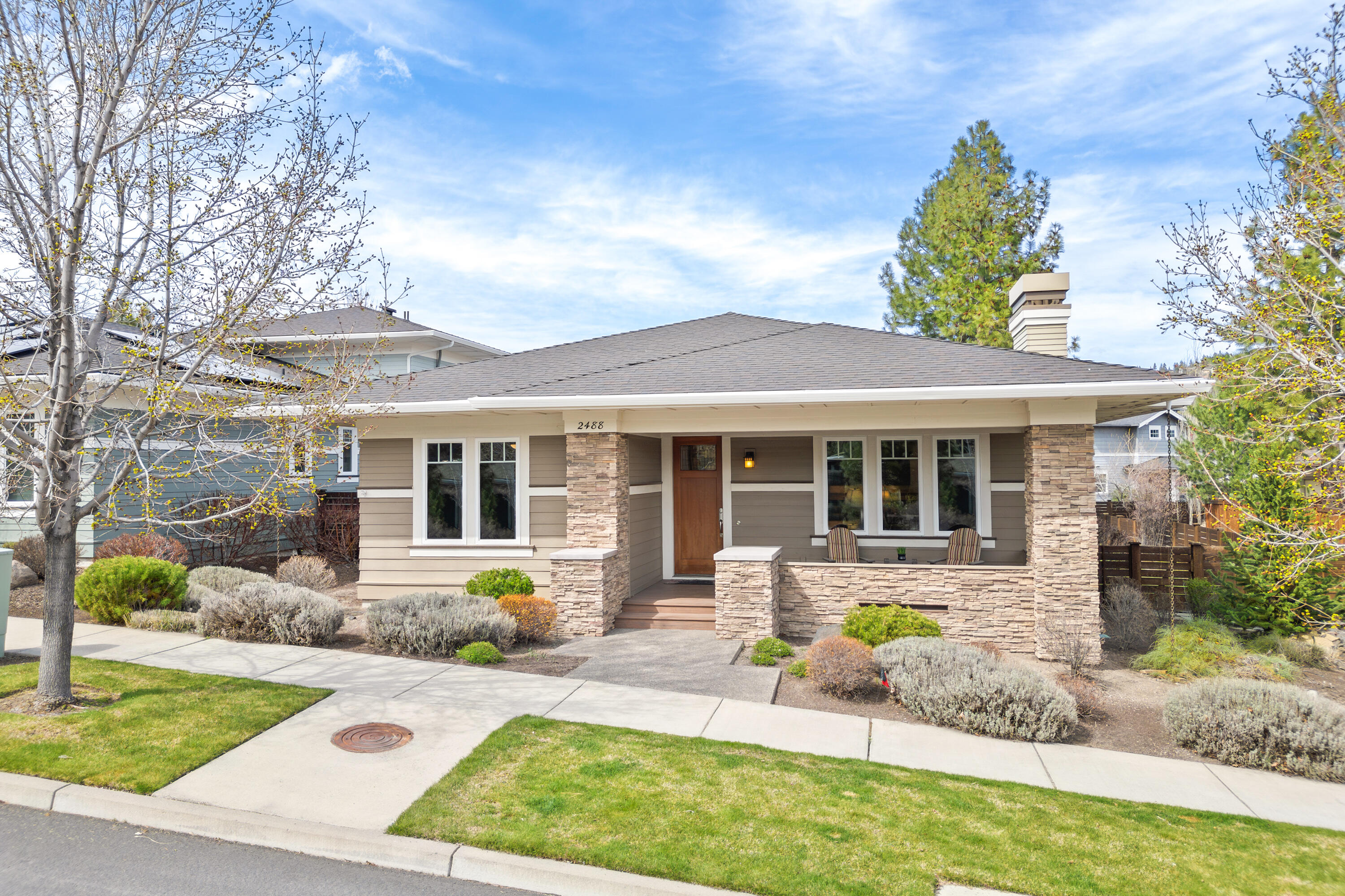 Nestled on a charming tree-lined street, this stunning single-level home offers the perfect blend of comfort, elegance, & functionality. The open floor plan boasts tall ceilings, engineered hardwood floors, abundant natural light (enhanced by southern exposure), a cozy fireplace, & custom built-ins. This home is ideal for both relaxing & entertaining with its warm & timeless appeal! The chef's kitchen stands out with granite countertops, kitchen island with breakfast bar, & a generous amount of custom cabinetry & storage drawers. The spacious primary suite is separated from the guest rooms & features a walk-in closet, dual vanities, and a beautifully tiled shower. Enjoy outdoor living on the covered front & back decks, surrounded by a fully fenced & nicely landscaped yard with towering trees. Located in Northwest Crossing, you'll love being close to parks, scenic trails, schools, and vibrant local favorites like the Saturday Farmers Market, charming shops, and amazing restaurants!
