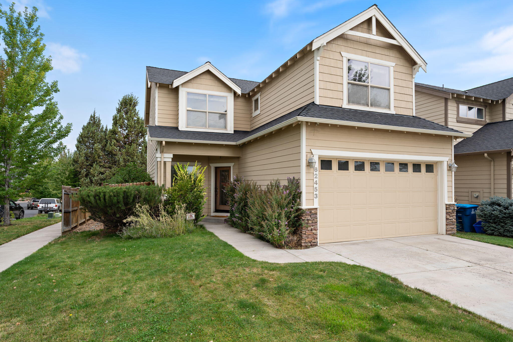 Great value in NE Bend! This well-kept home sits on a low-maintenance corner lot close to schools, parks, shopping, food carts, coffee shops, the hospital, & more. Enjoy peek-a-boo mtn. views, fireworks in the distance, the uber popular Pine Nursery & Big Sky Park just down the road, which is in a community that embraces the Central Oregon lifestyle. Inside you'll find 3 spacious BD's (all upstairs), 2.5 BA's, plus a main-level bedroom/den or office, & 2 car garage & with ample parking. The light & bright open floor plan features solid surface counters, new stainless steel appliances, gas fireplace, hardwood floors, & new carpet throughout, and a well maintained furnace & A/C. The large primary suite offers vaulted ceilings, a spa-like bath w/ soaking tub & tiled shower, & a generous walk-in closet with great bedroom separation. Outside, enjoy easy-care landscaping & room to grille & entertain. A competitively priced, move-in-ready home that blends comfort, convenience, & charm.