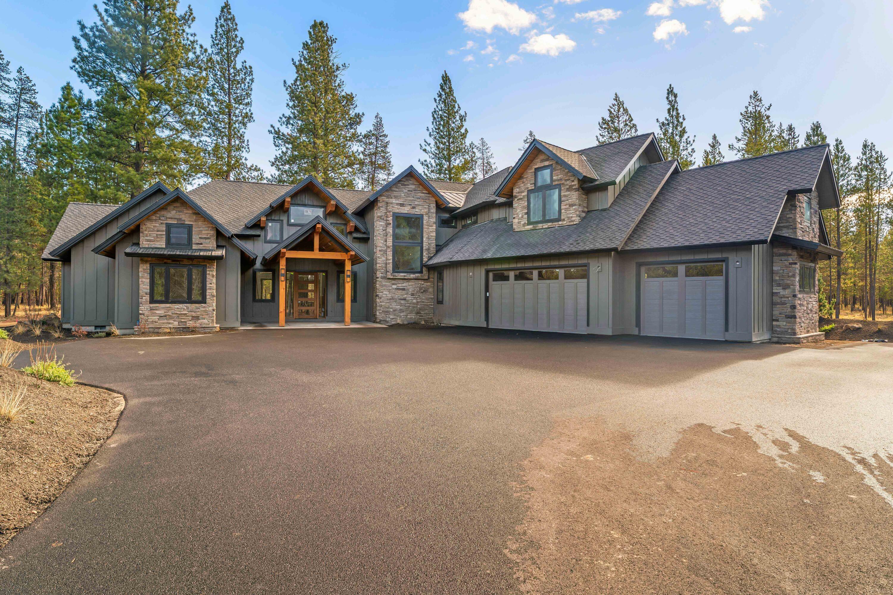 Discover refined mountain living in this exceptional 38-acre estate offering privacy, elegance, and comfort. The 4,412 sq ft home features 5 bedrooms and 5.5 bathrooms, including two main-level primary suites with spa-like baths, zero-entry showers, soaking tubs, and walk-in closets. The open floor plan highlights hardwood floors, vaulted ceilings, and a great room with gas fireplace and panoramic glass doors leading to a covered patio—ideal for entertaining or relaxing. The gourmet kitchen offers soapstone countertops, a gas range with pot filler, large island with eating bar, and a walk-in pantry. Upstairs includes additional bedrooms with private en-suites, a spacious bonus room, and guest bath. Additional features include a laundry/mudroom, three-car garage, and optional space for a future pole barn. Conveniently located near Mt. Bachelor, Sunriver Airport, and the Deschutes River. Bordering Vandevert Ranch and Caldera Springs Resort.  No HOA fees or restrictions.