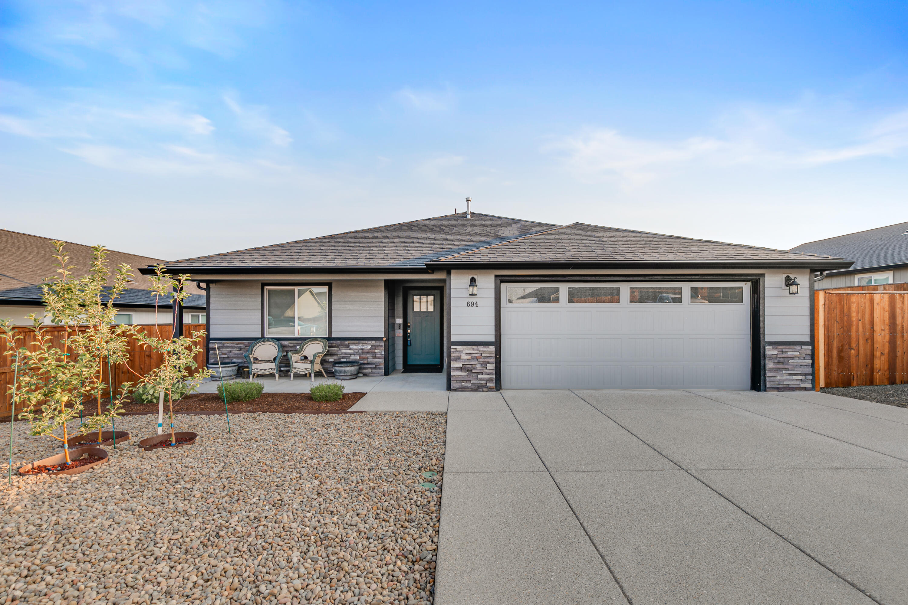 BETTER THAN NEW- New 2023
- lightly lived-in
- Seller sacrifice
- Move-in ready
- One-Level
- 4 bedrooms, 2 baths
- Open space, no rear neighbors
- Privacy + peaceful views
- Vaulted ceilings
- Lots of light

SMART FEATURES
- AV - 77' LG 4K OLED, 8-speakers, Dolby Atmos
- Smart StarFish lighting
- Security system
- Smart doorlock
- Video doorbell
- Internet, Gigabit WIRED in EVERY room
- SwitchBot programmable blackout drapes
- Lighting, On/Off occupancy-sensing

KITCHEN
- quartz counters & island
- Professional Viking gas range
- near-new LG fridge
- Pantry

MASTER BEDROOM/BATH
- SwitchBot blackout drapes
- New TILED shower
- Two shower-heads w/ handheld
- Full dim/bright lighting
- Bidet

GARAGE
- Two 240V outlets (for EV charger & welder/compressor)
- Sturdy workbench
- Tool mount wall

OUTSIDE
- Huge RV parking
- Covered patio + gas rotisserie BBQ
- Apple trees, Fuji, Granny Smith & Honey Crisp 
- Automated & minimum maintenance