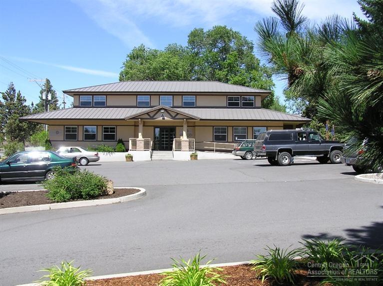 Office park/campus. 2+ acres with two office buildings, one warehouse/shop building and land to build approximately 14,000 sf building. Owner currently occupies the warehouse building and the office buildings are 75% occupied with a local tenants. Good opportunity for an investor/developer to enjoy existing cash flow and develop the balance of the property, or a great opportunity for a company desiring a campus setting with room to grow. Much of the infrastructure is in place for additional development.