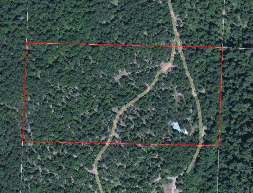 Quiet country living surrounded by trees. Manufactured home has been added onto. Fruit trees, seasonal pond and wildlife. Backed by BLM. Harvestable timber on the property. Property sold as is. Cash only sale.
