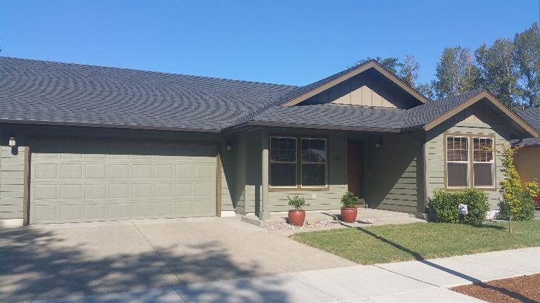 Immaculate, finished in 2013, Jacoby built 3 bedroom, 2 full bath home in small subdivision with city services. Open living floor plan with vaulted ceilings, custom hardwood floors, matching white high-end Whirlpool appliances with French-door refrigerator, combination electric convection and regular oven, with ceramic cooktop and built-in microwave. Third bedroom has French doors and could be a den or craft room. Fully landscaped, irrigated, backyard flagstone patio with no neighbors directly behind you, raised-garden beds, apple tree, blueberries, strawberries, easy maintenance yard. Finished double car garage with extra parking.