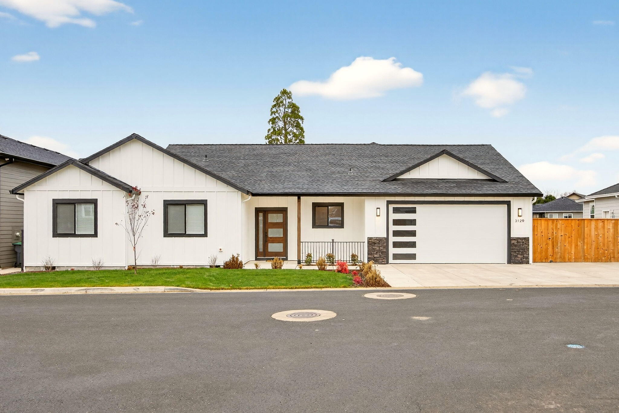 Exceptional 2025 new construction in East Medford's highly sought-after Cedar Landing community! This single-level 4-bedroom, 2-bath home offers 1,832 sq ft of refined craftsmanship with vaulted and 9-ft ceilings, abundant natural light, and a spacious open-concept design. The gourmet kitchen showcases soft-close cabinetry, leathered granite countertops, stainless steel appliances, an eating bar, and a large walk-in pantry. The primary suite overlooks the backyard and features a walk-in closet and a beautifully tiled shower. Additional highlights include luxury laminate flooring, a flex/office/4th bedroom with double doors, a generous laundry room, and elegantly finished tile-surround bathrooms. Enjoy a covered front and back patio, RV parking with an oversized driveway, a finished 2-car garage, and a large fenced backyard with sprinklers backing to open space. Close to parks, schools, and local amenities—this move-in ready home is truly a must-see!