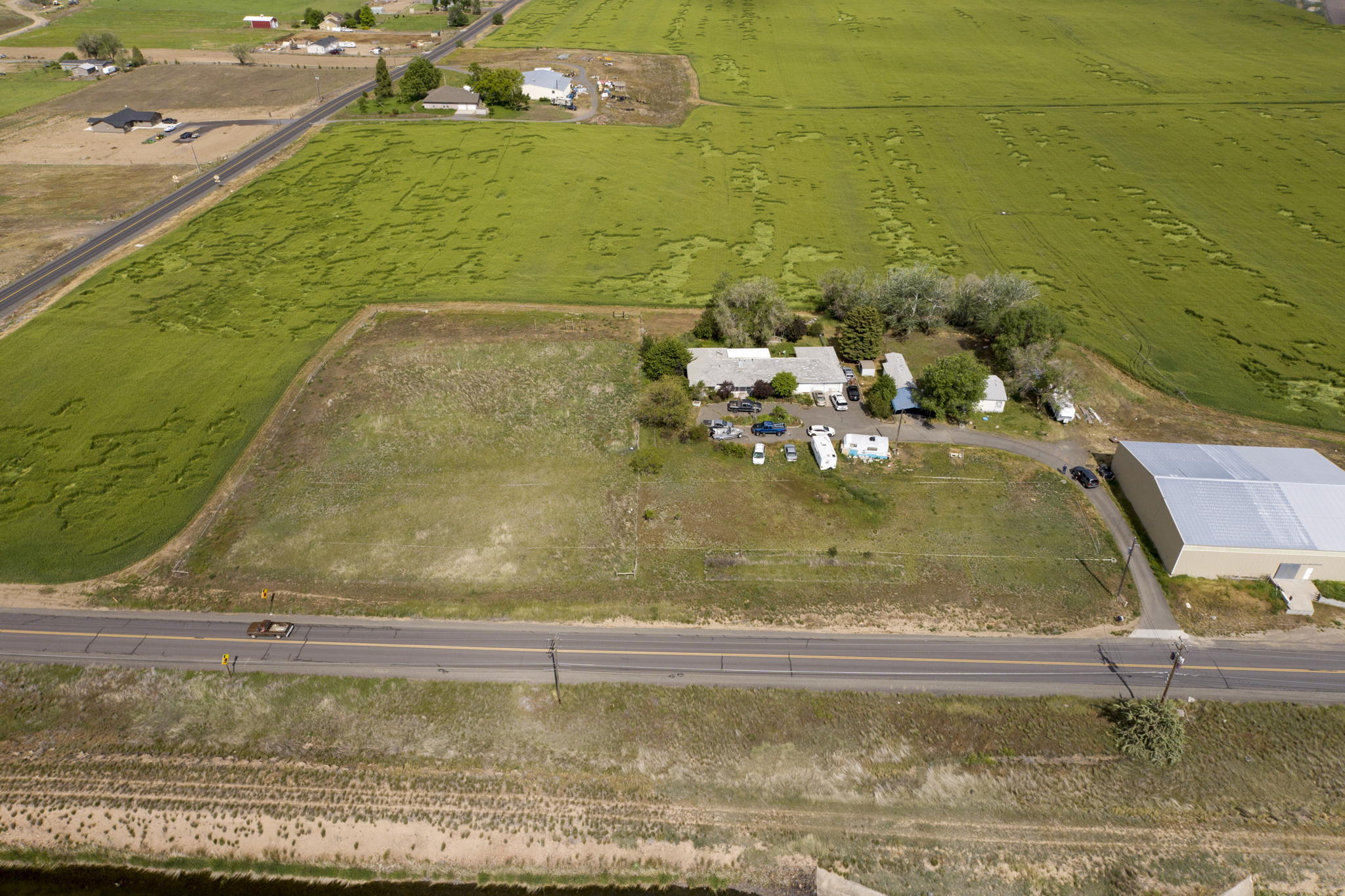 Great one level Ranch style home with Living Room, Family room and 2 additional flex spaces. Large Utility Room. Site built Home is 3 Bdrm 2 ½ bath 2090sf built in 1979 and the Mfg. Home is 3 Bdrm 2 Bath built in 1998 1080 sf. Both dwellings are permitted and legal per Jefferson County Planning Dept . Two separate permitted and approved septic systems on the property. Homes have deferred maintenance and property is priced accordingly. North Unit Irrigation water rights. Double attached garage on the main house. Two Other storage buildings on site. Wonderful Cascade Mountain views from the subject property and Views of the Buttes to the East. Surrounded by larger farm parcels. Gas furnace with heat pump. Mature landscaping. Asphalt driveway and parking. Lots of room for RV parking.