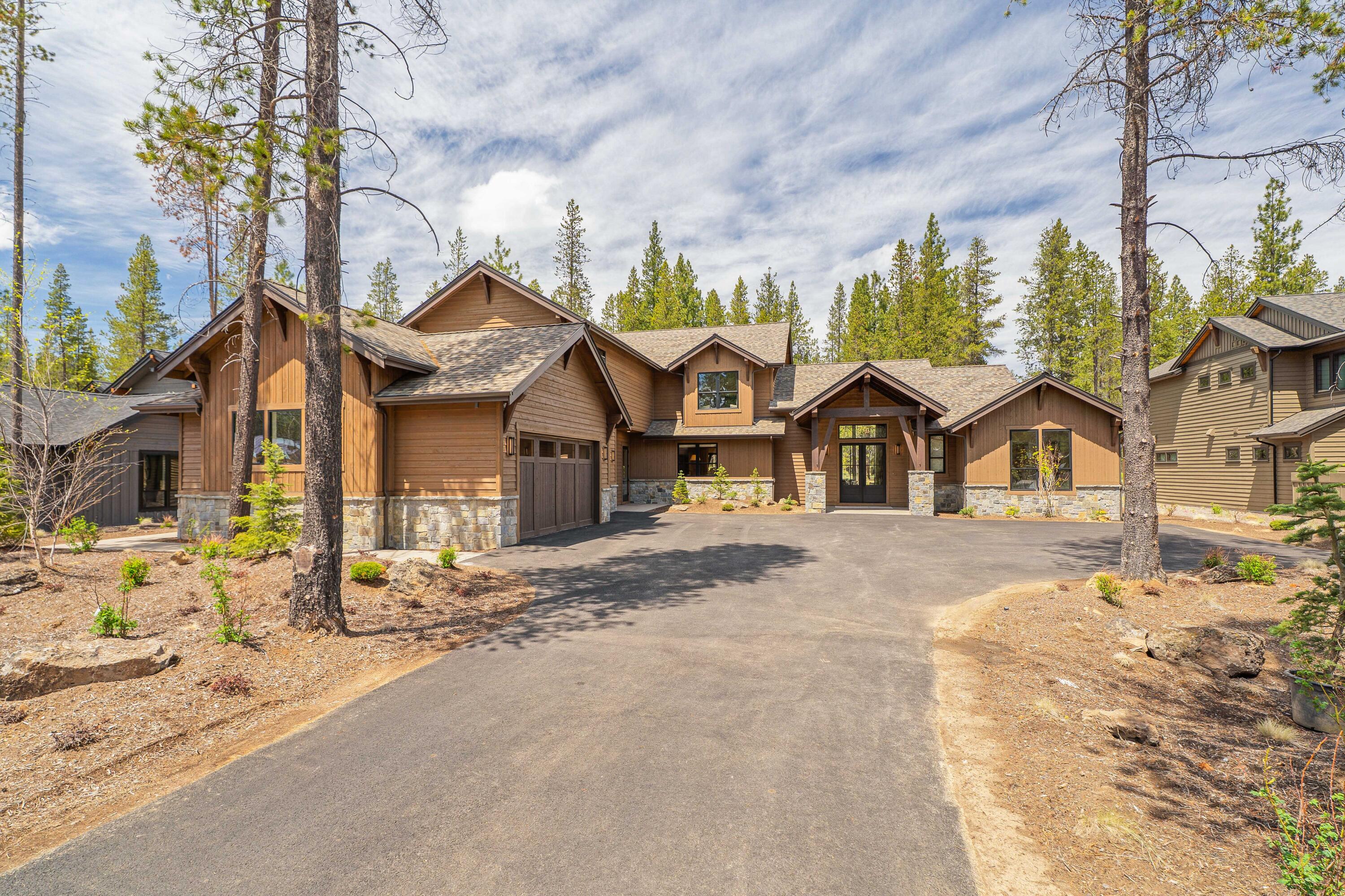 Come make this mountain home in Caldera Springs your Sunriver basecamp this Summer! It is in one of the most private and sought-after locations in the community—Everwild Circle. This property seamlessly blends modern sophistication with the tranquility of its natural surroundings, offering a lifestyle like no other. As you step inside, be enchanted by the graceful flow of open living spaces bathed in abundant natural light. The heart of this home is a gourmet kitchen that leaves nothing to be desired. Entertain in style in the interconnected great and bonus rooms on the main level, where multiple fireplaces beckon relaxation. Slide open the large doors to reveal a backyard oasis featuring a sunken spa and over 600 square feet of outdoor living space. It is an entertainer's dream, perfect for enchanting alfresco dining or hosting soirées beneath the stars. Sold fully furnished, this is not just a house; it's your dream home waiting to become a reality.
