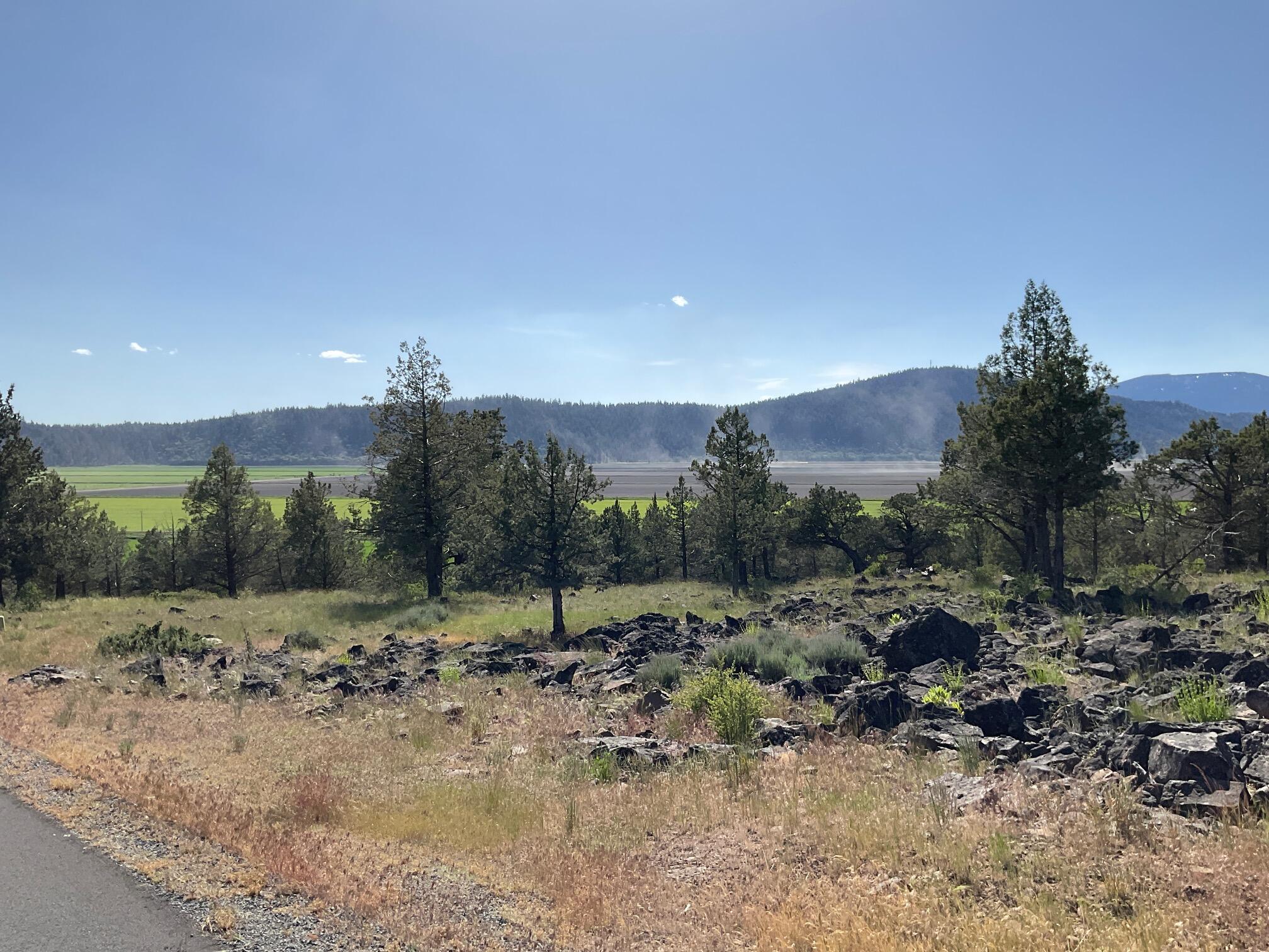 Over an acre, this home site at the Running Y Resort has panorama views of the Cascade mountains, the ranch and farm lands and incredible sunsets.  Every view is different but this one is special!!  Buy now and plan for your dream home.  Enjoy the golf course, fitness center, restaurants and outdoor sports courts.  It's a lifestyle!