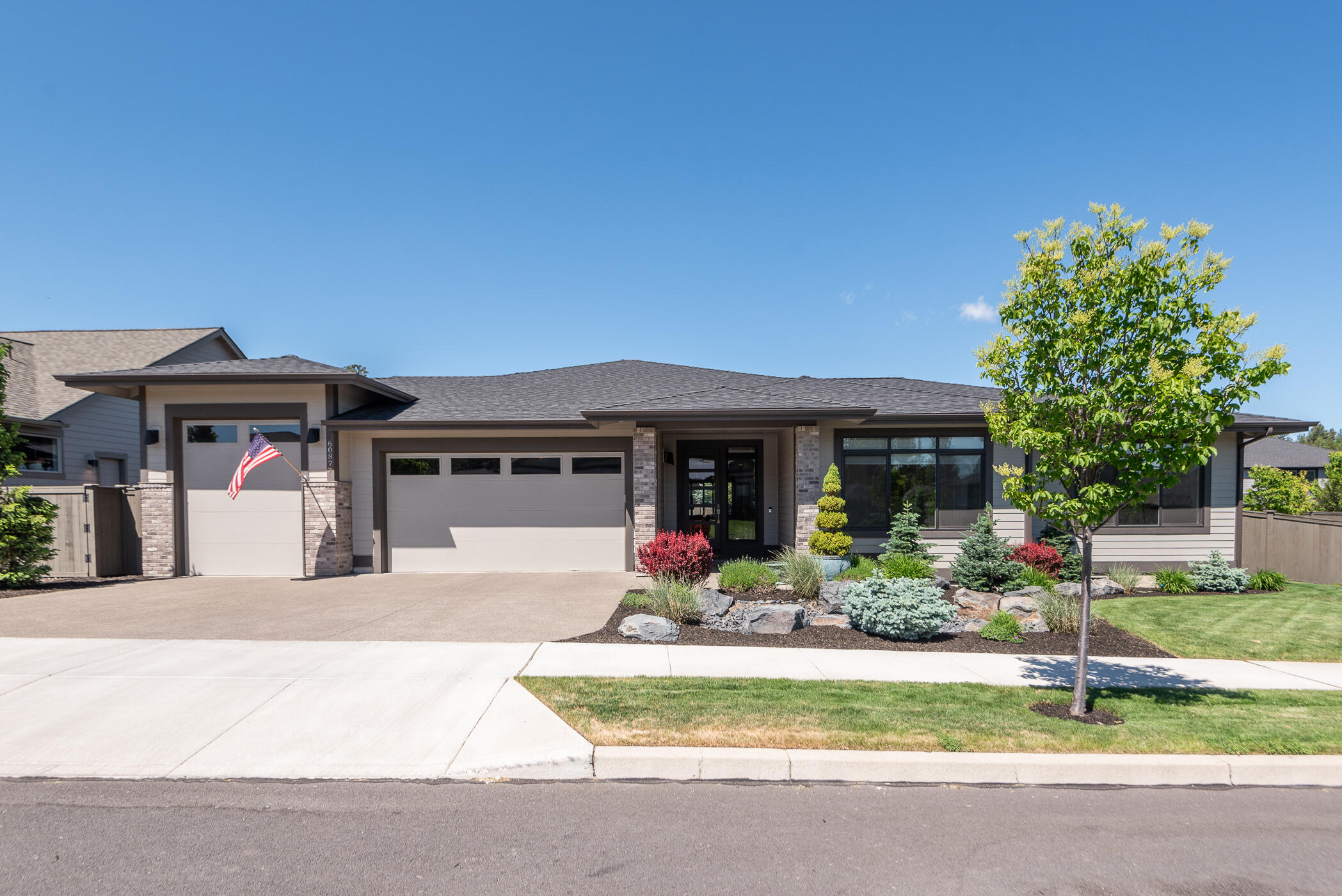 UPSCALE ONE-LEVEL 2775sf, 4 bed/3ba home w/an entertainer's dream floor plan & high ceilings throughout located on .23ac corner lot in Bend's idyllic River Vale neighborhood. The gorgeous chef's kitchen w/tons of storage and practical work space (including butler's pantry(!) &stainless steel KitchenAid appliances. Great room area has a stone fireplace & built-in bookshelves, wood flooring & over-sized sliding doors to the patio and lush backyard. Roomy  primary suite plus a Junior suite w/full bath & walk-in closet, one additional guest room with walk-in closet, and bedroom #4 w/tall doors would be a nice office facing the front of the home. Large laundry/mud room off the garage includes more storage. Lots of practical storage options! The 3-bay garage w/10' RV door. Enjoy ''end of the road privacy'' and a ten-minute walk to groceries, shops, gym, coffee & dining or hop on the River Trail and take in the sunset or views of the Deschutes.  Minutes to Old Mill District or downtown.