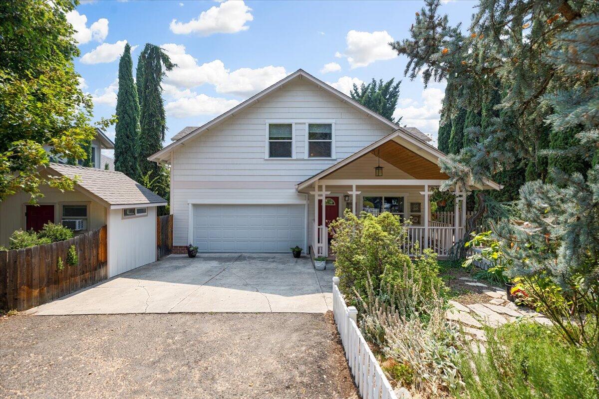 ''SOLD ONLY'' For Statistical Purposes Only! 
Your dream cottage with a white picket fence awaits! You'll find it on a quiet country street in Talent, surrounded by green space. The sophisticated floor plan has primary suites both upstairs and down. Bamboo flooring flows from the generous living room into the open kitchen. A tiled island/breakfast bar anchors the kitchen. A double window and sliding glass door frame views of greenery outside. The primary suite downstairs has a walk-in closet and upscale bathroom with beautiful tiled shower. Upstairs, the light and spacious second primary suite has several cozy nooks. Use them for an office, media center, meditation space--your choice! A brick patio and shady pergola just off the kitchen are perfect for entertaining. Side yard is gated at the street for RV parking. The finished and insulated side shed will make a perfect office, art studio or potting shed.
