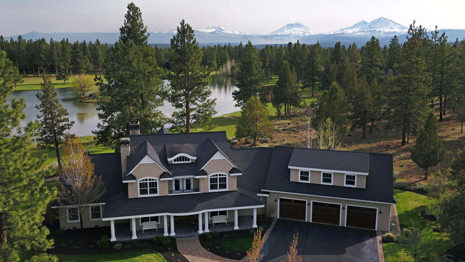 Premiere Aspen lakes property with view of Broken Top, lake, & golf course. Interior features: Open floor plan; High vaulted ceilings; abundant light & views; Library/study with numerous built-in bookcases; Wide plank hardwood floors throughout downstairs; Gourmet kitchen with oversized pantry & extra office/workspace; High-end appliances; Soapstone countertops; Large eating bar; Private first level primary bedroom with large bathroom & walk-in closet; Additional downstairs ensuite bedroom & bathroom; Flex room (workout/office/bedroom); Large laundry/mudroom; Upstairs loft area; Two large upstairs bedrooms with outdoor balconies; Large upstairs bathroom with high-end finishes; Upstairs washer/dryer; Huge bonus room; Generous storage. Exterior features: Oversized & heated garage; Multiple covered and open outdoor living spaces; Extensive landscaping with underground irrigation system; Home not within striking distance of golf course; Large circular driveway with plenty of extra parking