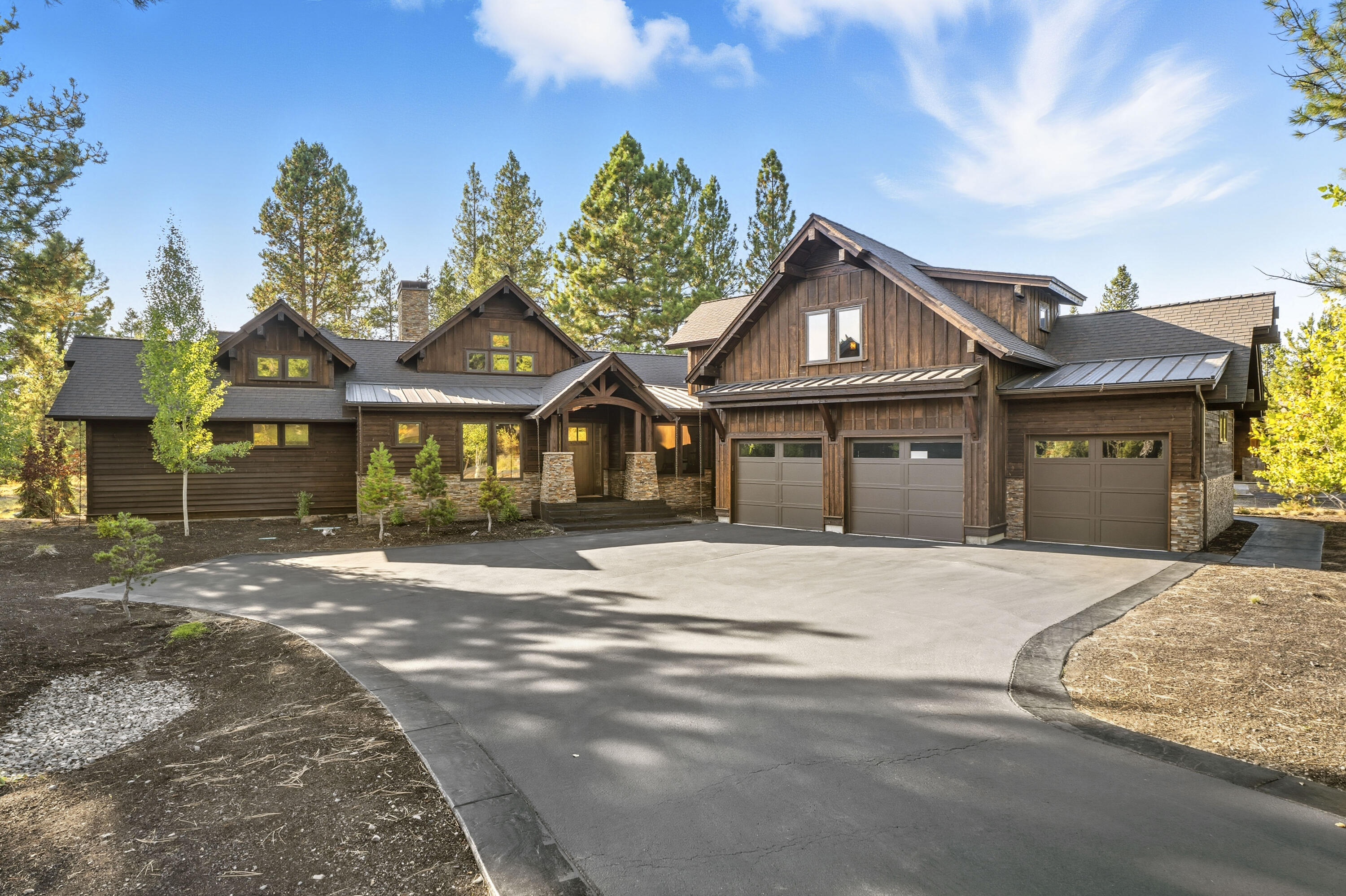 Why leave when you have it all right here? Swim laps or soak in your private swim spa, recharge in the home gym, relax by the outdoor gas fireplace, or unwind in the custom steam room. The chef's kitchen features Viking appliances and a wine fridge at the dry bar, perfect for entertaining. With two main-level ensuites, a three-car garage with storage racks, and ample space throughout, this home is built for both comfort and convenience. Upstairs, enjoy two private bedrooms, a shared bath, and a cozy sitting area for guests or family.

Step outside to a freshly stained exterior, patio and deck work recently completed, and quick access to all that Caldera Springs has to offer paddle across Obsidian or Trailmere Lakes, dine lakeside, or stay active at the Fitness Center. When winter calls or there is a need for big city fun, Mt. Bachelor and Bend are only 20 minutes away.

Every season brings an adventure here at Caldera Springs without ever sacrificing the comforts of home.
