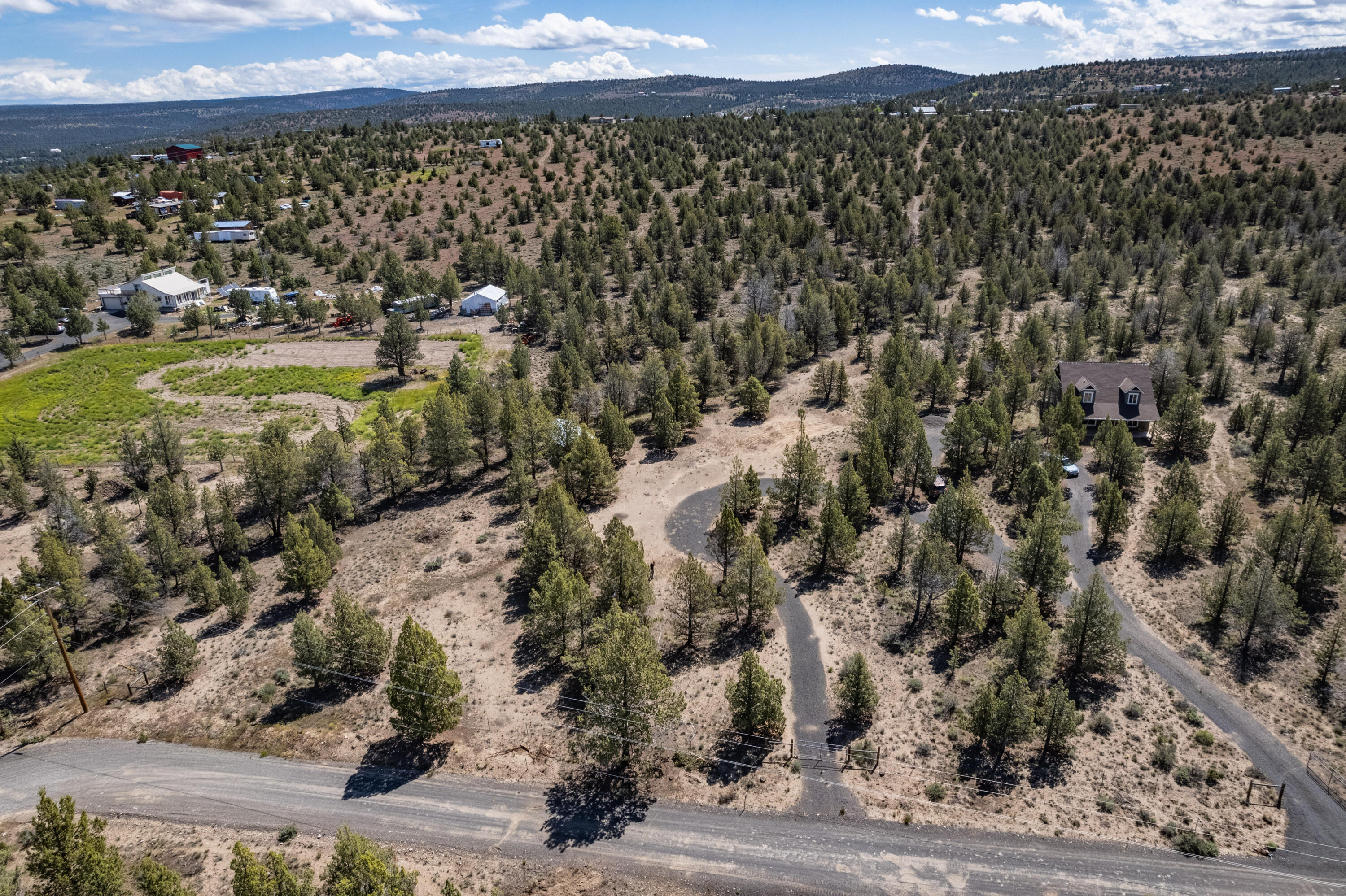 Don't miss your chance to build your dream home in the heart of Central Oregon where you can live, play, adventure, & call this 1.86 acre lot your own! Buildable lot w/ a barn/horse coral already in place, fenced on three sides! Bring your imagination, room for RV parking, horses, critters, all of your outdoor toys + more! If you're looking for a bigger lot w/an already in place home the lot shown next door in the photos (all lot lines approximate) Call today!