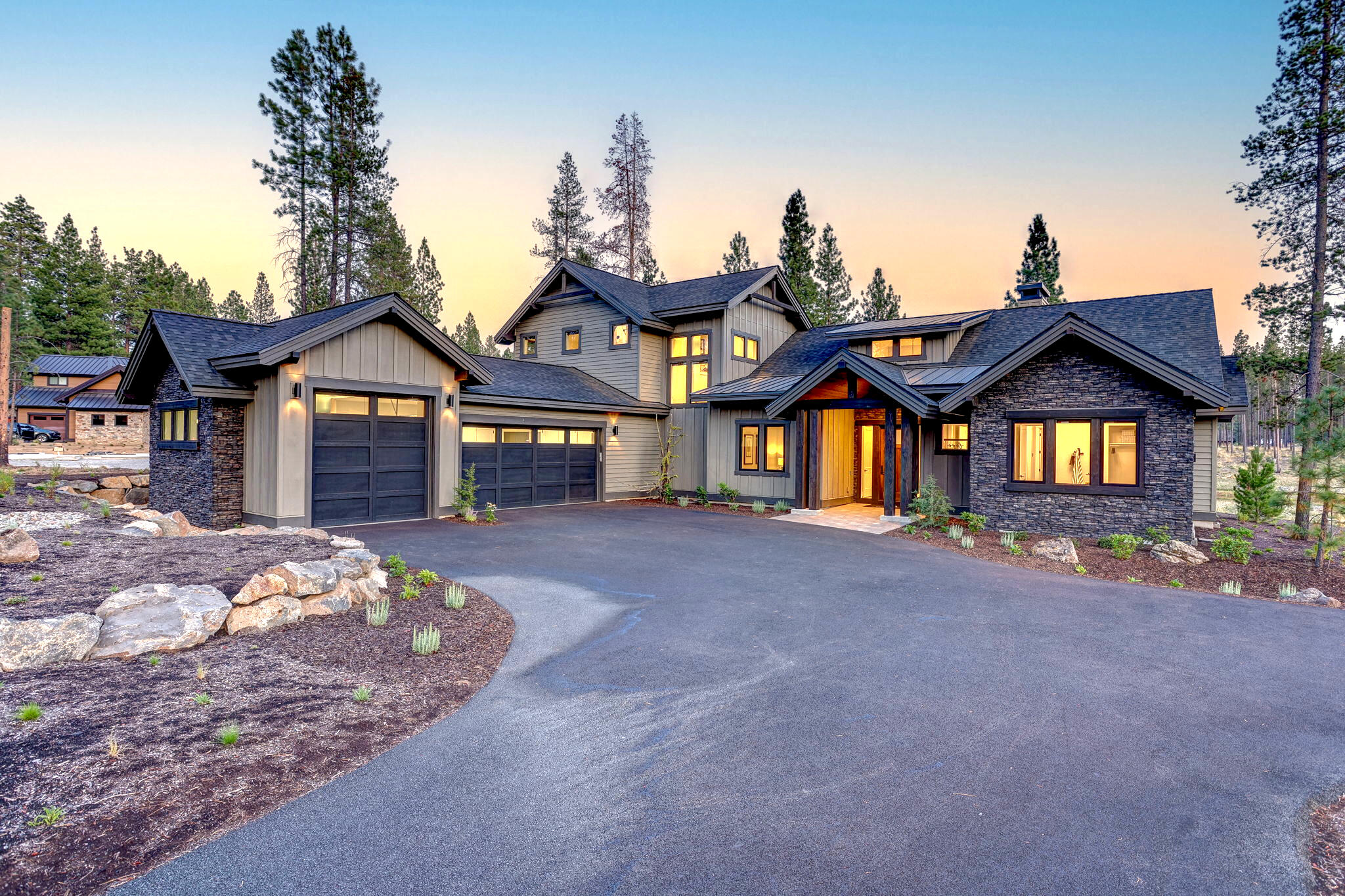 Winner of the 2024 Central Oregon Builder's Association Tour 'Best of Show', this stunning new home built by Pahlisch Select, is nestled in the heart of the coveted Caldera Springs Resort. This luxury residence offers breathtaking views of a serene pond & open space. Designer-selected amenities include elegant quartz countertops, exquisite white oak cabinetry, and stone fireplace. The gourmet kitchen is equipped with high-end Fisher & Paykel appliances, and a wet bar, perfect for culinary enthusiasts. Thoughtfully designed, the home features 3 main level ensuites, an additional bedroom/office on the main,and an upper-level bonus room & bunk room. With 5 full bathrooms, two walk-in pantries, a 3-car garage with epoxy flooring, and ample storage, this home effortlessly combines functionality with luxury. Relax in the hot tub and savor outdoor living & entertaining on the south-facing covered patio with stunning water views. Owners enjoy full access to all Caldera Springs' amenities.
