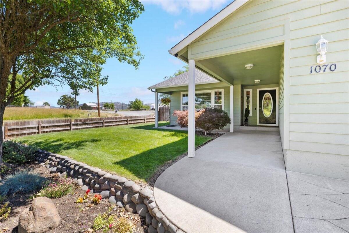 Price is available for a short period, until 7/25 This stunning 2,189 sq ft home boasts 4 bedrooms, and 3 full bathrooms, sits on a .19 acre corner lot, offering panoramic views from its elevated position. Inside is a seamless open floor plan with vaulted ceilings and hardwood floors creating an inviting atmosphere. The kitchen is a focal point, featuring granite countertops, stainless steel appliances, and a 5-burner gas stove. The primary suite offers a spacious walk-in closet and luxurious bathroom. Outside, enjoy covered patios, a private backyard with a fire pit, NEW SAUNA & HOT TUB, and breathtaking mountain views. With the added benefit of R/V parking access, and newly installed SOLAR PANELS, this home combines modern comfort with eco-friendly living and low energy cost. Don't miss the opportunity to experience this exceptional property, conveniently located just minutes from downtown. Schedule your tour today to see it all!