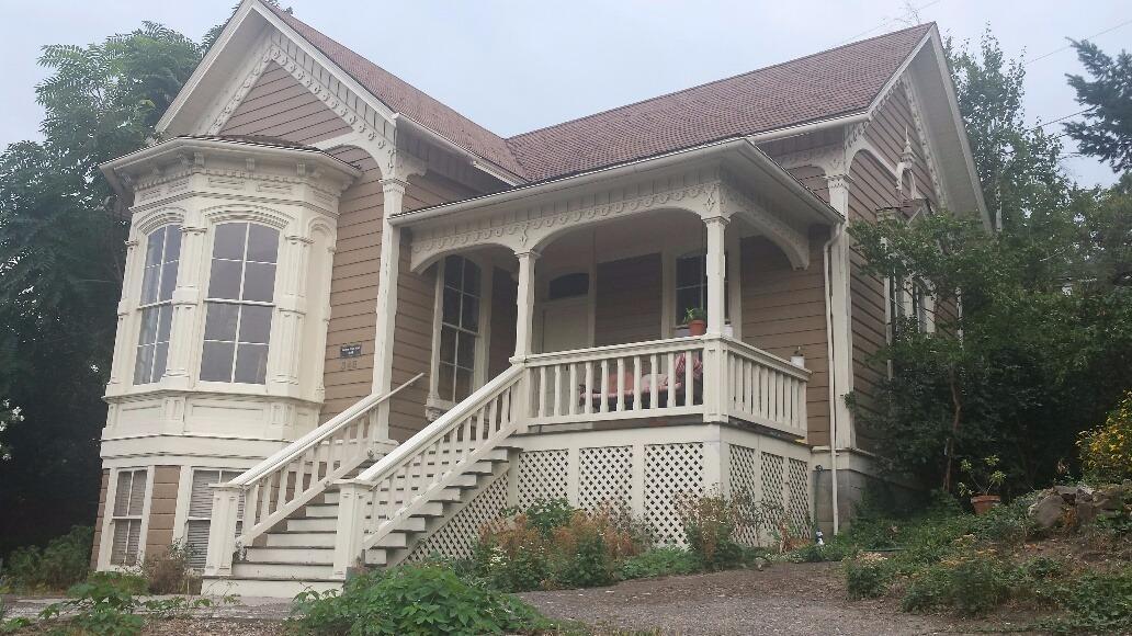 The home everyone has always admired in a premier location in downtown Ashland is on the market after many years of love from the current owner. Baldwin Beach Home was built by Baldwin Beach in 1884, a Civil Veteran who moved to Ashland in 1878 with his wife. The home features 11 foot ceilings, covered front porch, parlor, large eat in kitchen, two large bedrooms and two full baths on the main floor with a studio living space with private entrance in daylight basement (no interior stairs from main home). Wonderful large windows with mountain views and original wood floors. One block to downtown Ashland and private parking for three cars and .23 acre triangular lot. A very special home for the buyer looking for charm and historical location, location, location in Ashland. The plumbing, electrical and foundation were redone when current owner bought about 40 years ago. See attached document from City Ashland.