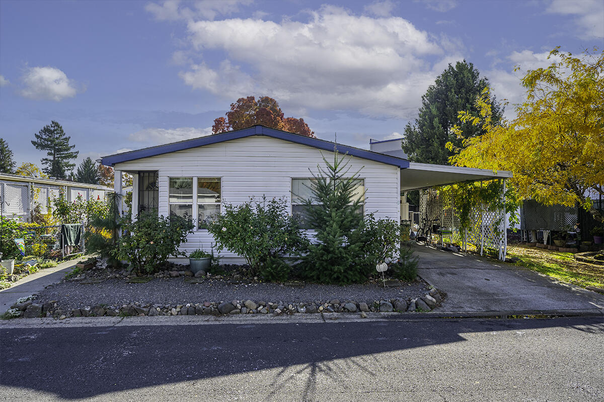 Location, location, location! Looking for a charming home in a 55+ community? If so, this is the one for you! This 1990-built home features 3 bedrooms, 2 bathrooms, 1056 sq ft, open floor plan, all appliances included, vaulted ceilings, enclosed patio, spacious yard, attached carport, detached shed, landscaped front and back, & much more! Space rent is $845 per month and includes clubhouse, pool, & gym. Great opportunity for anyone looking for a low maintenance property close to everything Medford has to offer!