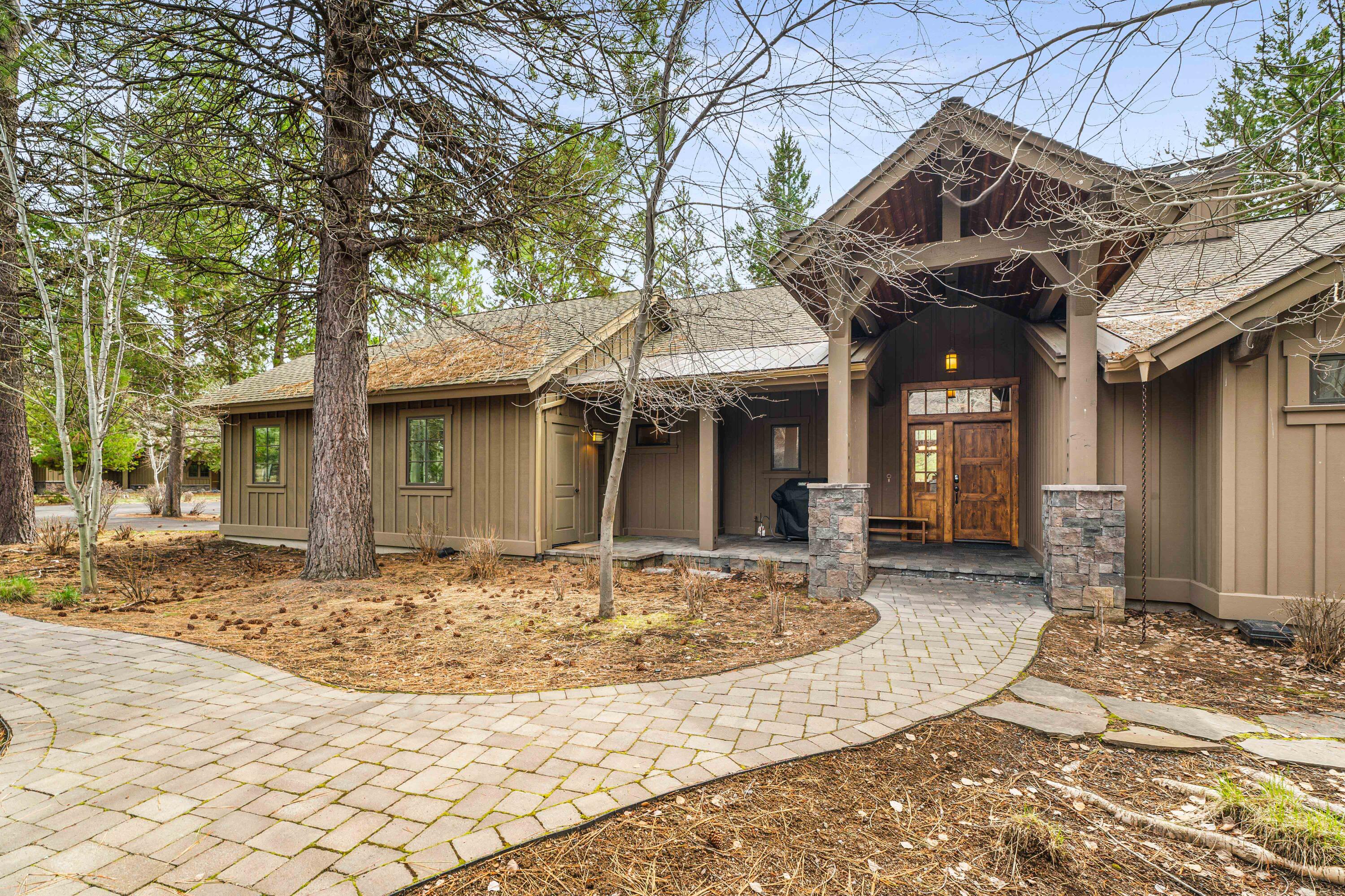 Beautiful single level Caldera Cabin on spacious lot with lake views! Relax and indulge in the Caldera Springs lifestyle in this picturesque setting near the Lake House and Quarry Pool & Fitness. Enjoy all of Caldera Springs' amenities including the fabulous new Forest House & Aquatic Center, golf, fitness, biking, trails, pickle ball, kayaking, dining lakeside, and more! High rental income potential with this warm & cozy vacation home built by Sun Forest Construction with quality finishes and great floor plan. Featuring 4 bedrooms, 3 of which are ensuites, a thoughtfully designed upscale kitchen, and back patio with a hot tub for outdoor living. Excellent condition with newer HVAC, refrigerator, microwave, hot tub, 65'' TV, BBQ, several new furniture pieces. Items in owner's locked storage/cabinets excluded. Great proximity to Sunriver, Bend, eateries, shopping, river & lakes. Just 30 minutes to world class skiing at Mt. Bachelor!