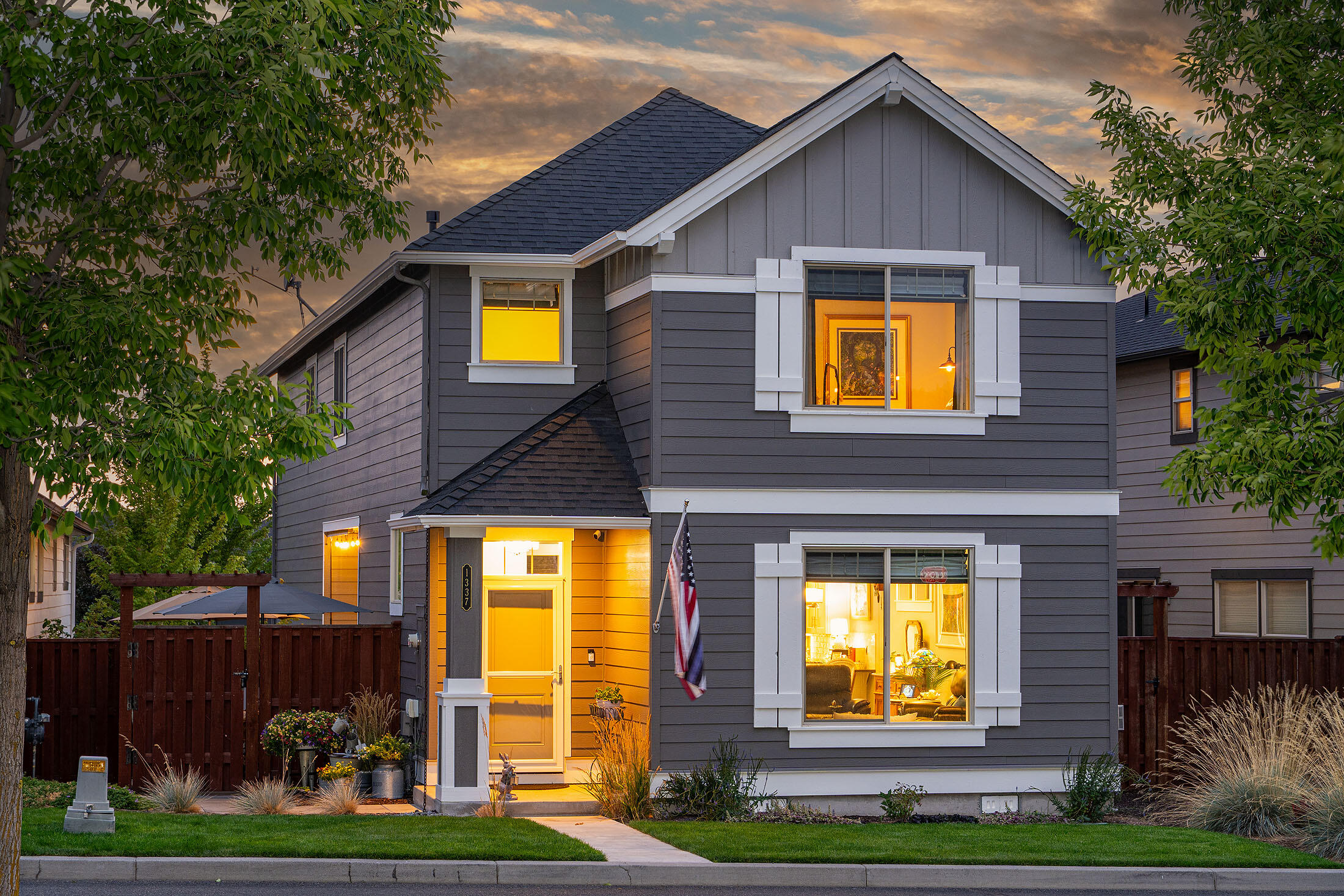 Experience this exceptional park-front property on a tranquil one-way street. This immaculate turnkey home highlights over $35,000 in luxurious builder upgrades, creating a peaceful craftsman cottage style retreat with its large, wood-wrapped windows displaying views of the community park and Barnes Butte. The redesigned main level features a spacious kitchen with a quartz eating bar, updated kitchen appliances, and stylish pendant lights that open to the dining area and great room, complete with a cozy gas masonry fireplace. Upstairs, a generous loft living space leads to the guest rooms, a full bath, and a laundry room, nicely separated from the impressive, large master suite, which offers stunning views and a luxurious bath suite with an upgraded tiled shower and a walk-in closet. Ochoco Pointe community offers resort-style amenities of front yard landscaping maintenance, a seasonal pool, children's play area, ½ sports court, and paved trail along the protected wetland reserve.