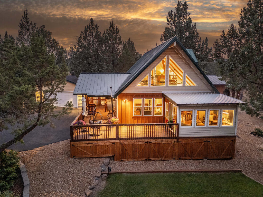 Set on a picturesque 2.5-acre corner lot, this beautifully remodeled 1-bed plus loft, 1.5-bath home offers 1,444 sq. ft. of comfortable, light-filled living. Step inside to soaring vaulted ceilings with exposed beams, hardwood floors, and an open layout designed for connection. The accessible entry welcomes you into a warm, inviting space where the kitchen flows seamlessly into the living room with pellet stove—perfect for high desert evenings.
Outside, unwind on the expansive deck overlooking mature landscaping or in the fully fenced backyard—ideal for entertaining or enjoying the peace and quiet. Additional highlights include a paver patio, orchard, shed, and artist studio. A 2-car garage, RV parking, and large driveway add convenience to this one-of-a-kind property.
Located in an established neighborhood minutes from both Bend and Redmond, this home blends rural charm with easy access to all the amenities of town. Experience the best of Central Oregon living!
