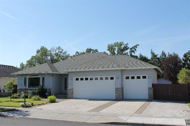 Highly sought after single level home on spacious lot, triple garage & RV parking w/electrical hookup. This home has been wonderfully maintained, updated slab quartz kitchen, full glass tile back splash. Matching storage/garden shed. Hardwood flooring throughout living, dining & kitchen areas,gas fireplace in great room open to kitchen, central vac, jetted tub, laundry room w/mud sink and cabinets. Soothing water feature & A/C for summer comfort! Located near shopping & medical.