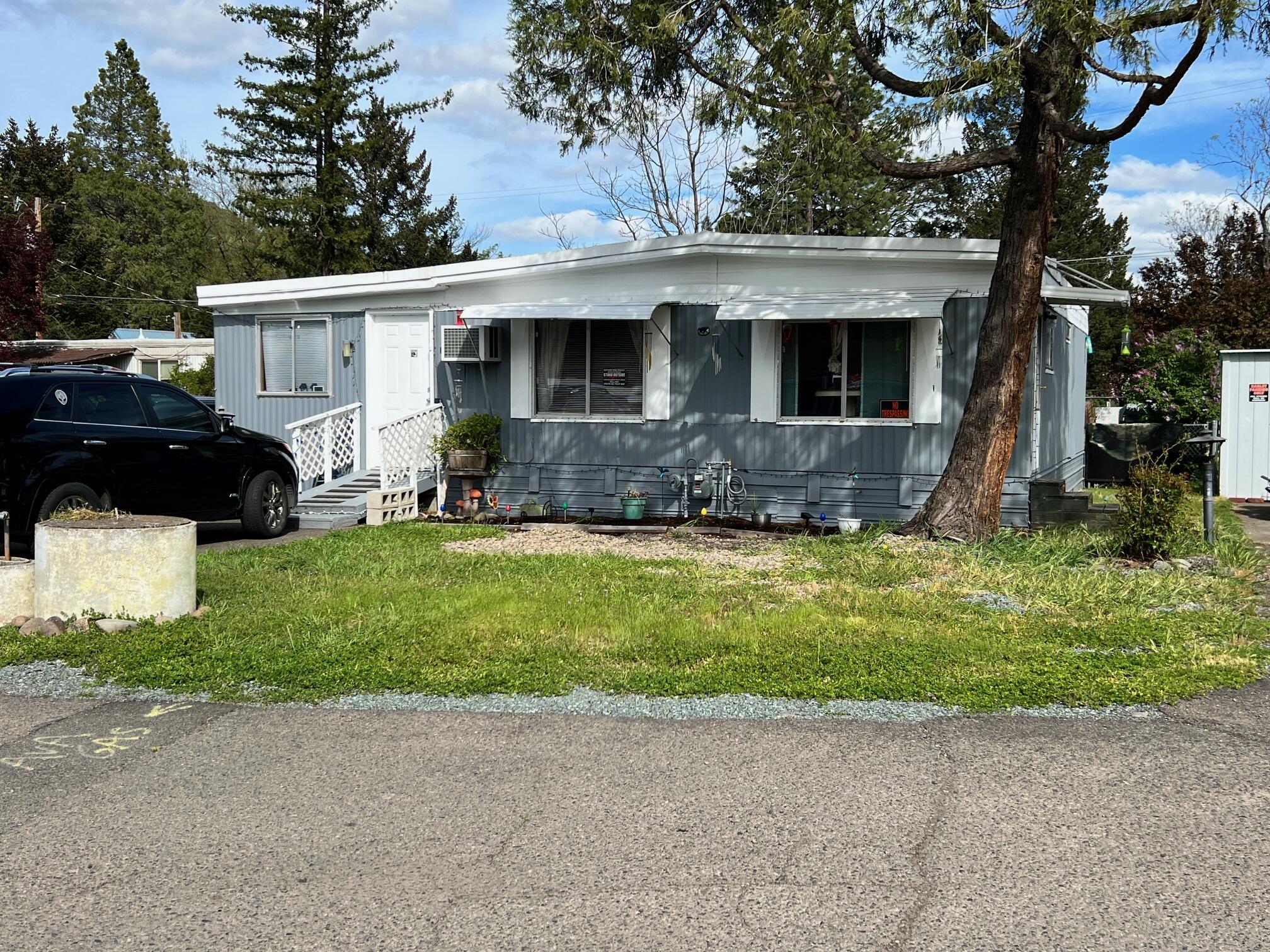 Great location near the Rogue River and downtown. Features include 3-bedrooms, 2-bathrooms and good-sized living room. Laminate flooring in living room and kitchen. The backyard is fenced, has a patio and a shed for extra storage. Don't miss out on this home. Assessor says 720 sq. ft. but with the addition of a bedroom and laundry room it adds 360 sq. ft. The additional space was added prior to current owners owning the property.