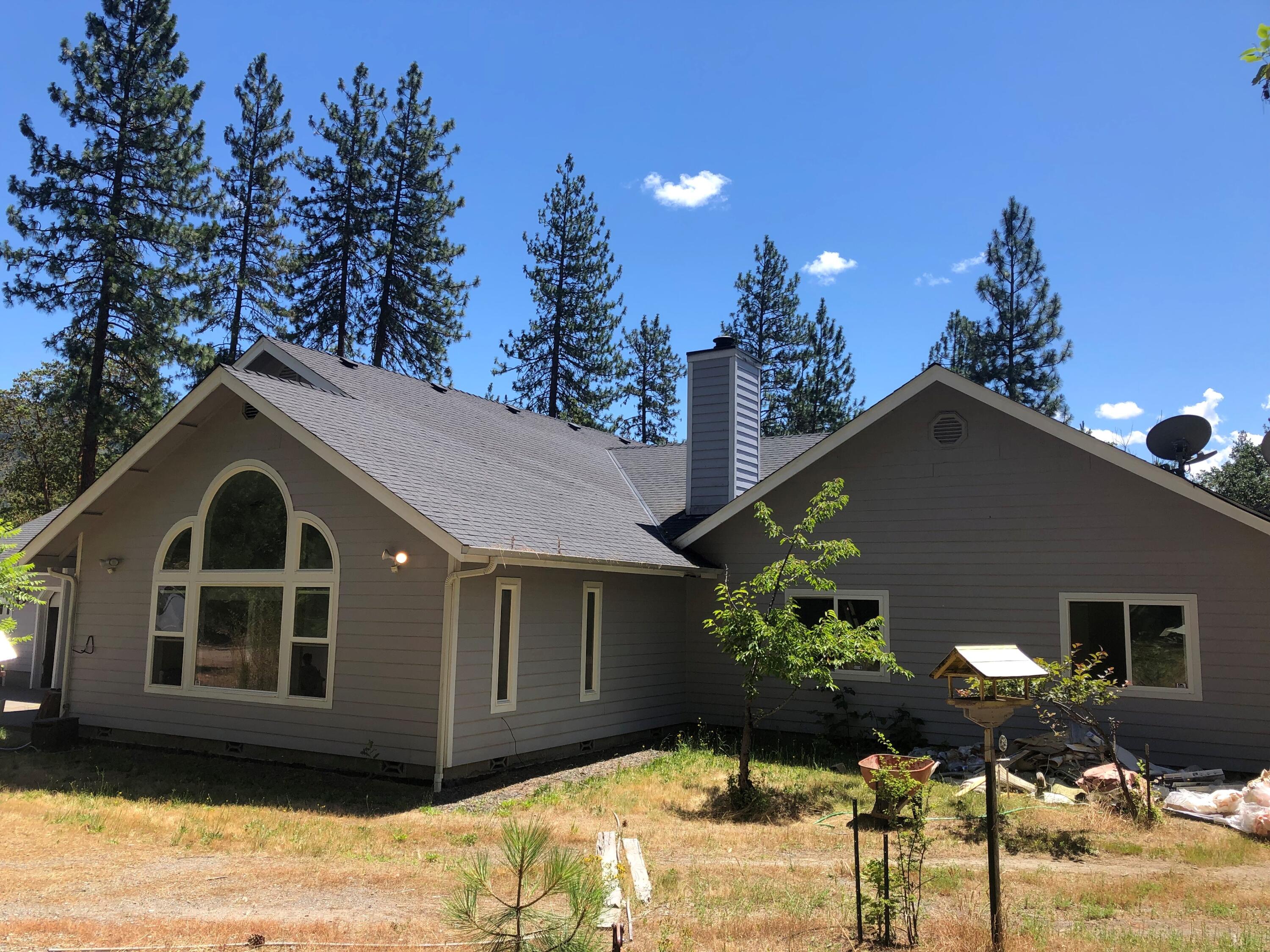 This home is located in the beautiful town of Williams on flat useable land with little over 5 acres fenced and with a gate for more privacy. Has 3 bedrooms. 2 1/2 bath, walk in closet, rock fireplace, Granite counter tops and travertine title a great big kitchen for entertaining. A pantry, laundry room, 3 car garage, hall closets, a small fenced in area in the back patio, located close to country store & school. It's a must see!