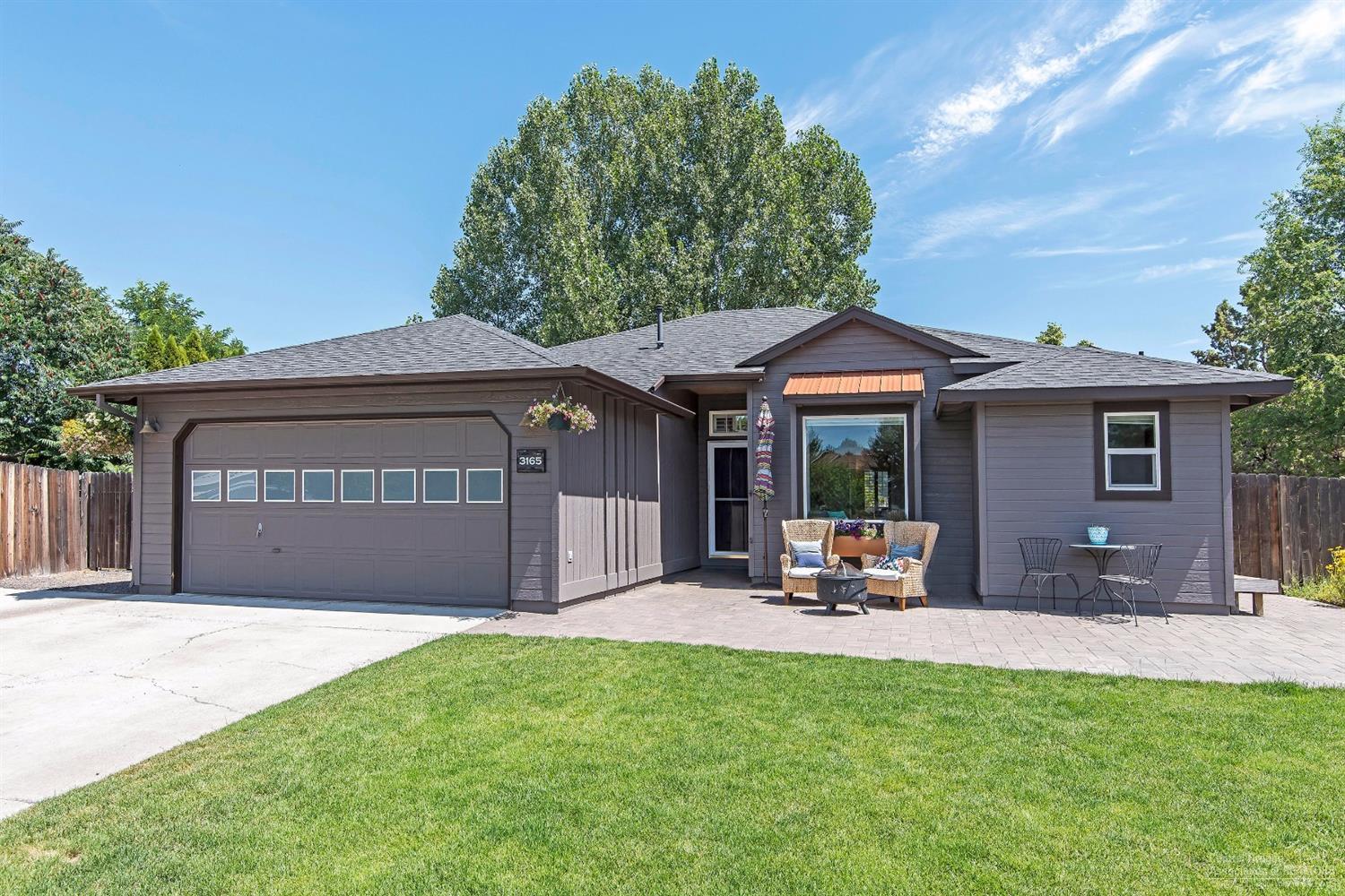 Cute single level home in NE Bend situated in a quiet cul-de-sac close to shopping, restaurants, medical facilities and a neighborhood park & playground. It has been nicely updated with hardwood floors throughout, gas fireplace with stone surround and hearth, quartz/silestone kitchen counters, newer S.S. appliances and recently updated guest bathroom with tiled floors & shower. Large .21 acre lot with gated and covered RV parking, fenced backyard with covered patio, a swim spa and plenty of room to garden.
