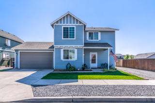 This 3 bedroom, 2.5 bathroom has ample room for projects and parking. It is located on the corner of SW Cascade and SW 31st in Redmond. It features a newly permitted attached tool room that is just under 600 sq feet! The 80ft parking area along the side is perfect for multiple vehicles, trailers, RV's etc. The large shed located in the backyard has been freshly painted and both yards have been recently landscaped with quality sod and new bark. Laminate flooring throughout the living room, dining area, and kitchen. Carpet on stairs and the 3 upstairs bedrooms. It has white appliances and a natural gas fireplace in the living room. Great location near schools, parks, shopping, and the swim center!