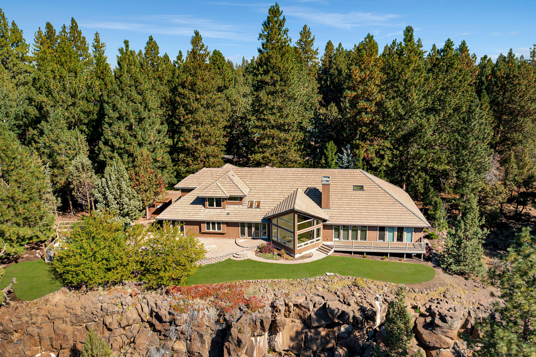 Price just reduced another $400,000! Extraordinary property w/3.9 acres & 470ft of mesmerizing Deschutes River frontage w/future development potential! The beautifully remodeled 4,680sq ft custom home features a grand entrance w/showpiece chandelier, & elegant spiral staircase. Huge arched walkways lead to a stunning vaulted living room w/full height granite slab mantle/propane fireplace, & huge bay windows overlooking panoramic river/mtn views. Gourmet kitchen w/top of the line appliances, enormous island w/new marble counters, & designer backsplash. Main level vaulted mstr w/huge walk-in closet, private flex rm, & mstr bath w/marble walk-in shower/soaking tub/bidet. New flooring, paint, surround sound, whole house intercom & remote window coverings. Rooms include; theater rm, gym, Lrg bonus rm, office, 2 lrg bedrooms w/walk-in closets & beautifully remodeled guest bath. The grounds are manicured in a park like setting w/huge trees, labyrinth path, paver driveway/patio, & greenhouse!