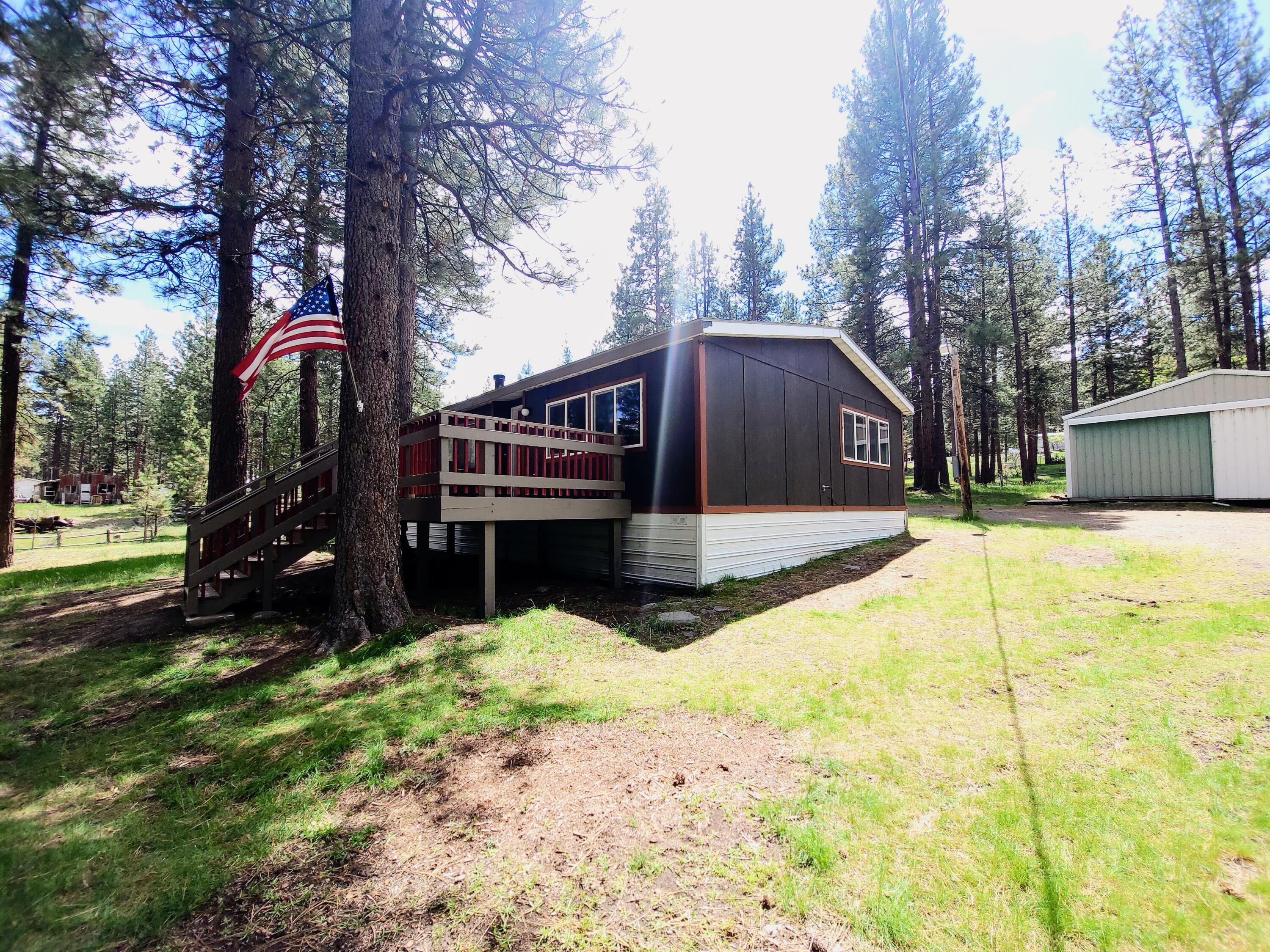 Want quiet, space, and stars instead of traffic and neighbors on every side? This 3 bed / 2 bath home on nearly 1 acre in Bly, Oregon offers a brand-new Trex deck (2025), newer roof (2023), workshop, and light (2) horse setup. Minutes from river access, trail systems, and endless recreation. Perfect as a peaceful primary home, getaway cabin, or second home in the pines.