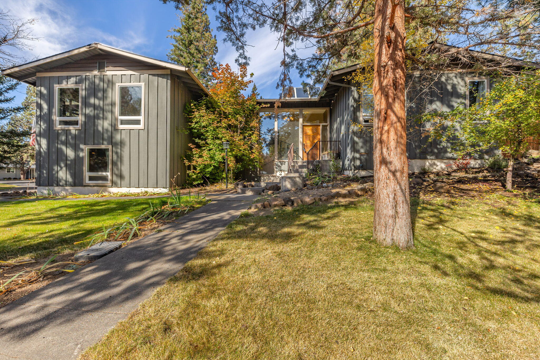 Explore numerous possibilities in this exceptionally unique & spacious Mid Century-style home located in Midtown Bend. Whether you require ample indoor or outdoor space, this property offers it all. It features multiple living areas, 4 generously sized BDs, 3 full BAs, extensive outdoor entertainment areas & ample onsite parking. The substantial .31-acre lot includes a hot tub/spa area, fire pit, fenced yard, covered patio w/ scenic views, RV parking, & the potential for a future shop & ADU.
This meticulously maintained home boasts large picture windows, vaulted tongue-and-groove ceilings, cherry cabinets, tile & wood flooring, wood-burning fireplaces, custom tile showers & counters, as well as all-new SS appl's, fresh interior paint, a newer roof & A/C system. The location is unbeatable, situated in Midtown, just a block from Ponderosa Park & Skatepark, the Larkspur trail, schools, shops, & dining establishments, with Juniper & Larkspur Aquatics & the Old Mill just a few minutes