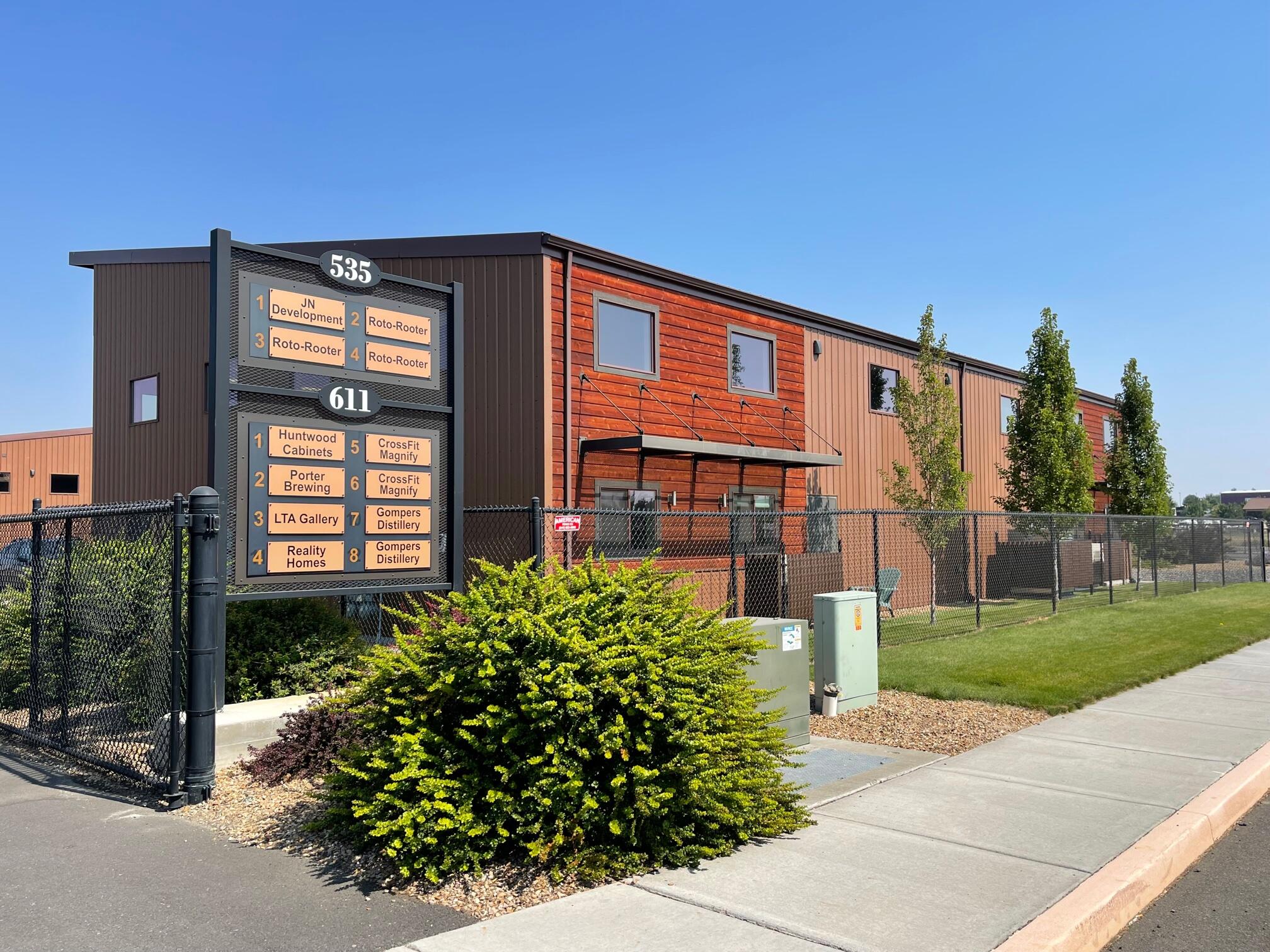 Originally constructed in 2018, this six (6) building industrial park is 100% leased to a diverse set of manufacturing, industrial service, and food & beverage manufacturing tenants.

Each unit has full HVAC in the office portion of the suite, Three Phase 480v electrical service, with one fourteen-foot roll-up door. Parking lot and access are shared between each of the eight (8) tenants with directional signage on the south end of the property.

The location in Redmond provides excellent access northbound to Highway 97 and fair to good access southbound to Highway 97.

The composition of the buildings includes a combination of distressed wood and metal skinned exteriors, over a wood-framed structure. Metal roofs and separately metered suites with glass relight panels in each of the roll-up doors provides natural light to each tenant.

Zoning is M1 Light Industrial, and the total rentable square footage of the property is 32,096 positioned on two separate tax lots totaling 2.13 acres.