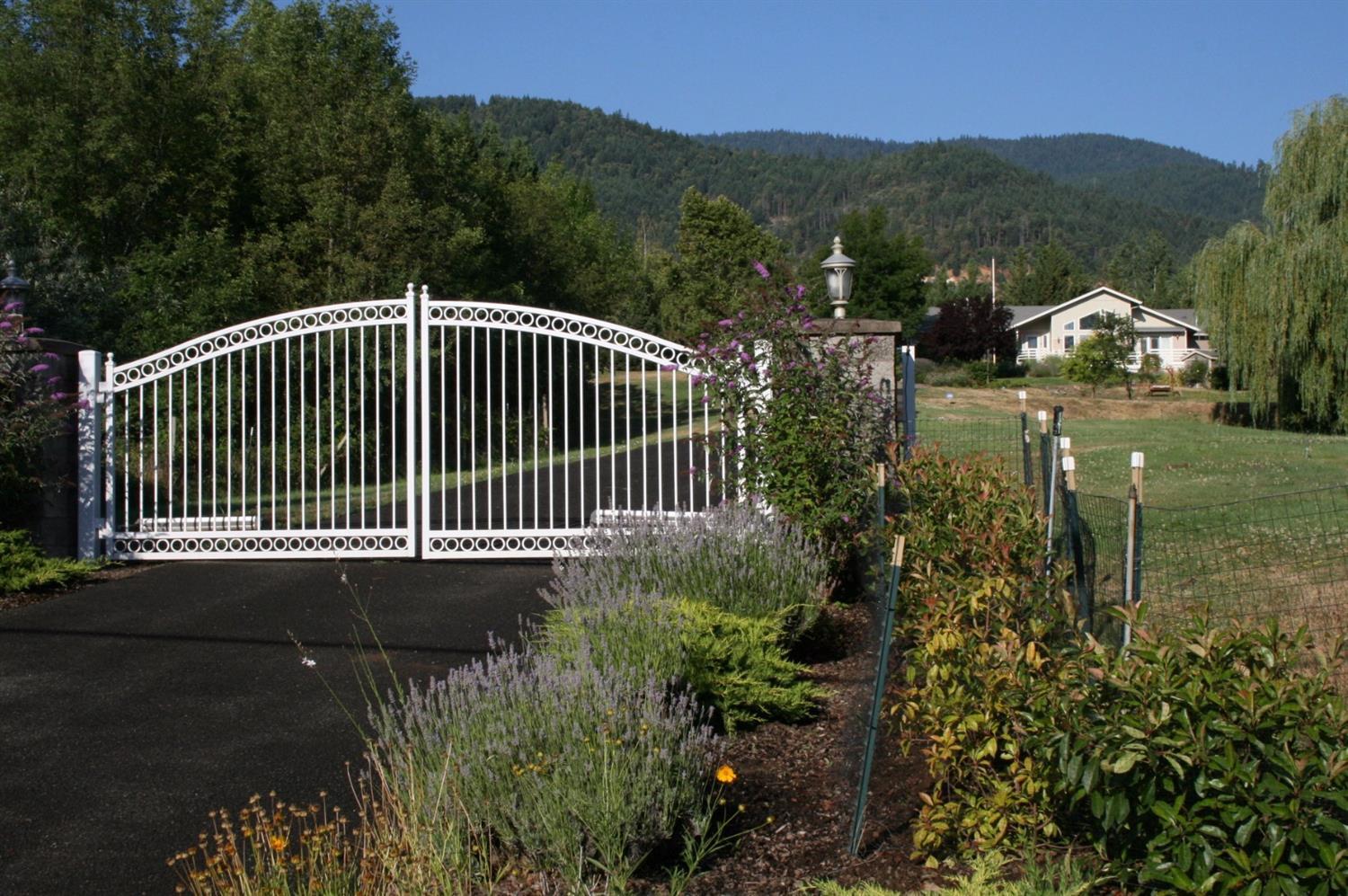 Experience rural living at its best with this most outstanding turn-key single level home and fabulous property located just minutes from downtown Ashland in the Sunny Oaks area of Emigrant Lake. Enjoy some of the most beautiful and panoramic views to be found anywhere in So. Oregon. The entire 4.32 acres is irrigated (T.I.D.) & features a lovely balance of trees, gardens, open lawn areas, and a beautiful year round pond. Separate guest quarters with attached garage, work shop space, and a full size enclosed RV garage (approx 45' X 23') , solar heated in-ground pool and spa. Interior remodeling in 2012 includes new kitchen, all new baths, and a long list of first class home amenities throughout.