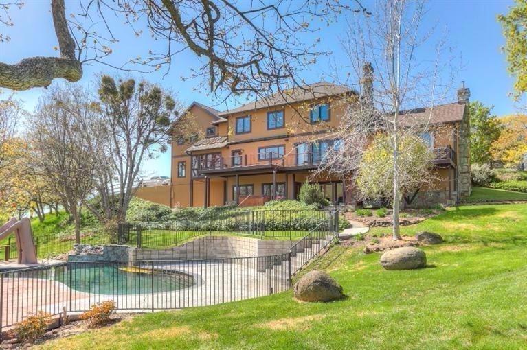 Gorgeous estate in the desired Pompadour neighborhood on one of the most spectacular settings in Ashland. The home is spacious and has 4 bedrooms, formal and informal living spaces, a gym and 2 offices. Numerous decks with never ending valley views and overlooking the beautiful salt water inground pool. There is a detached barn that has lots of storage. Some pasture and arena space on this over 50 acre parcel with about 2 acres of mature landscaping.