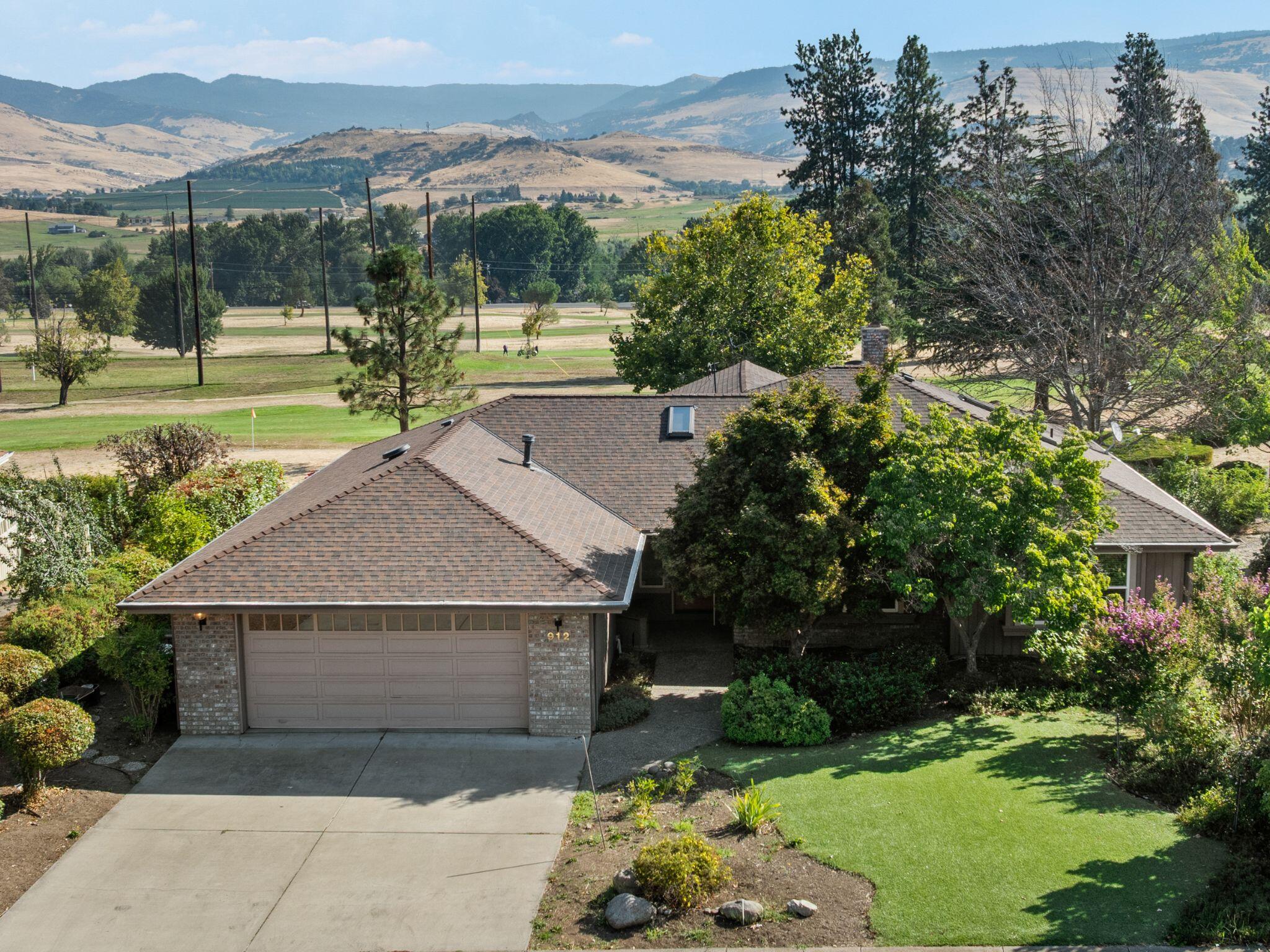 This beautifully maintained single-level home is tucked away on Cypress Point Loop, a charming neighborhood within the Oak Knoll Subdivision. From the back deck, enjoy sweeping views of the golf course and Siskiyou and Cascade mountain ranges, along with access to miles of walking trails. Inside, two primary suites—each with a full bathroom—plus a third bedroom, ample storage, and skylights filling the home with natural light create both comfort and convenience.